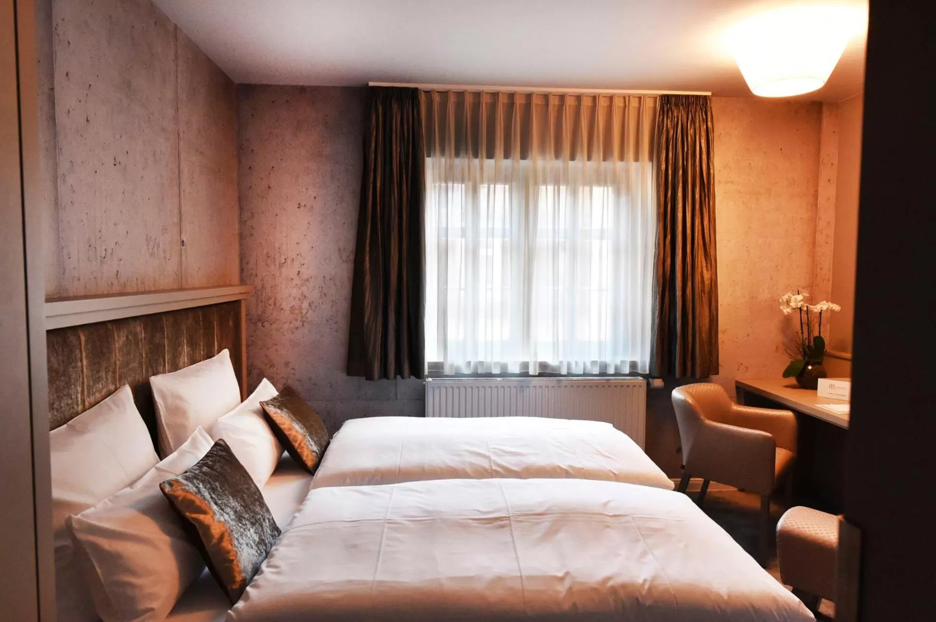 Photo of the whole room, Bed in MOMENTS Boutique Hotel