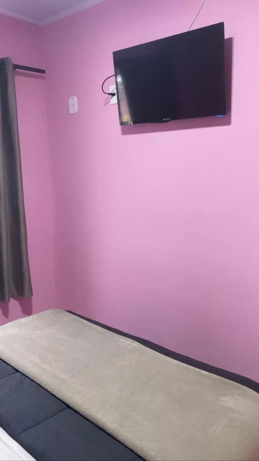 Bed in Pousada Mercosul