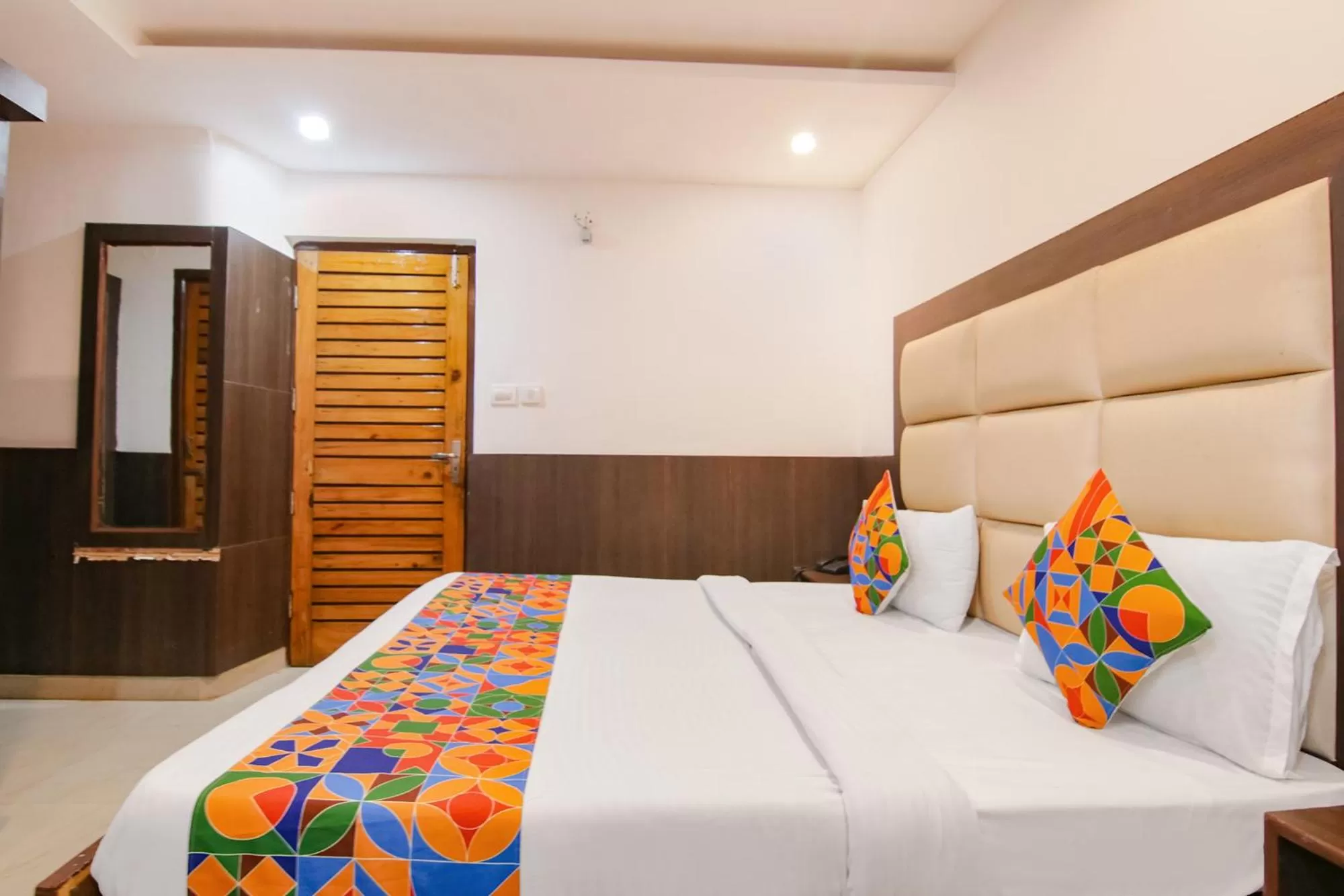 Bed in FabHotel Rosewood Inn I