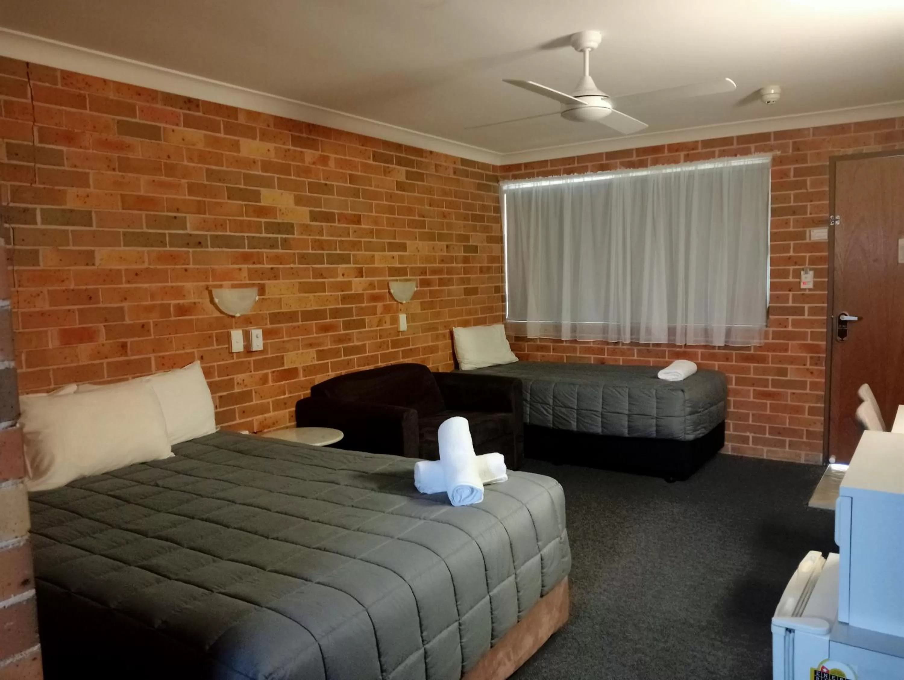 Bed in Forster Palms Motel