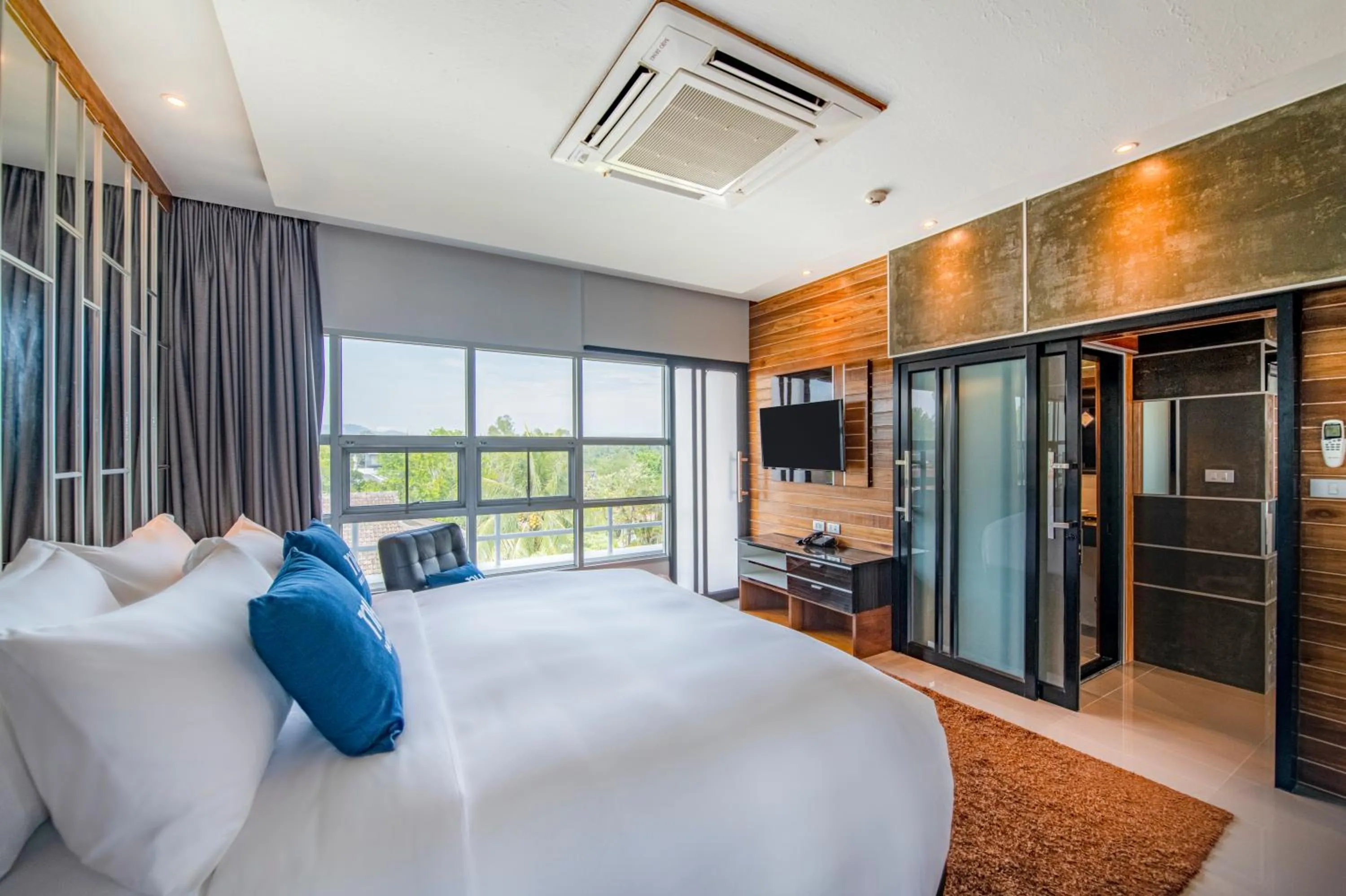 Bed in NH Boat Lagoon Phuket Resort