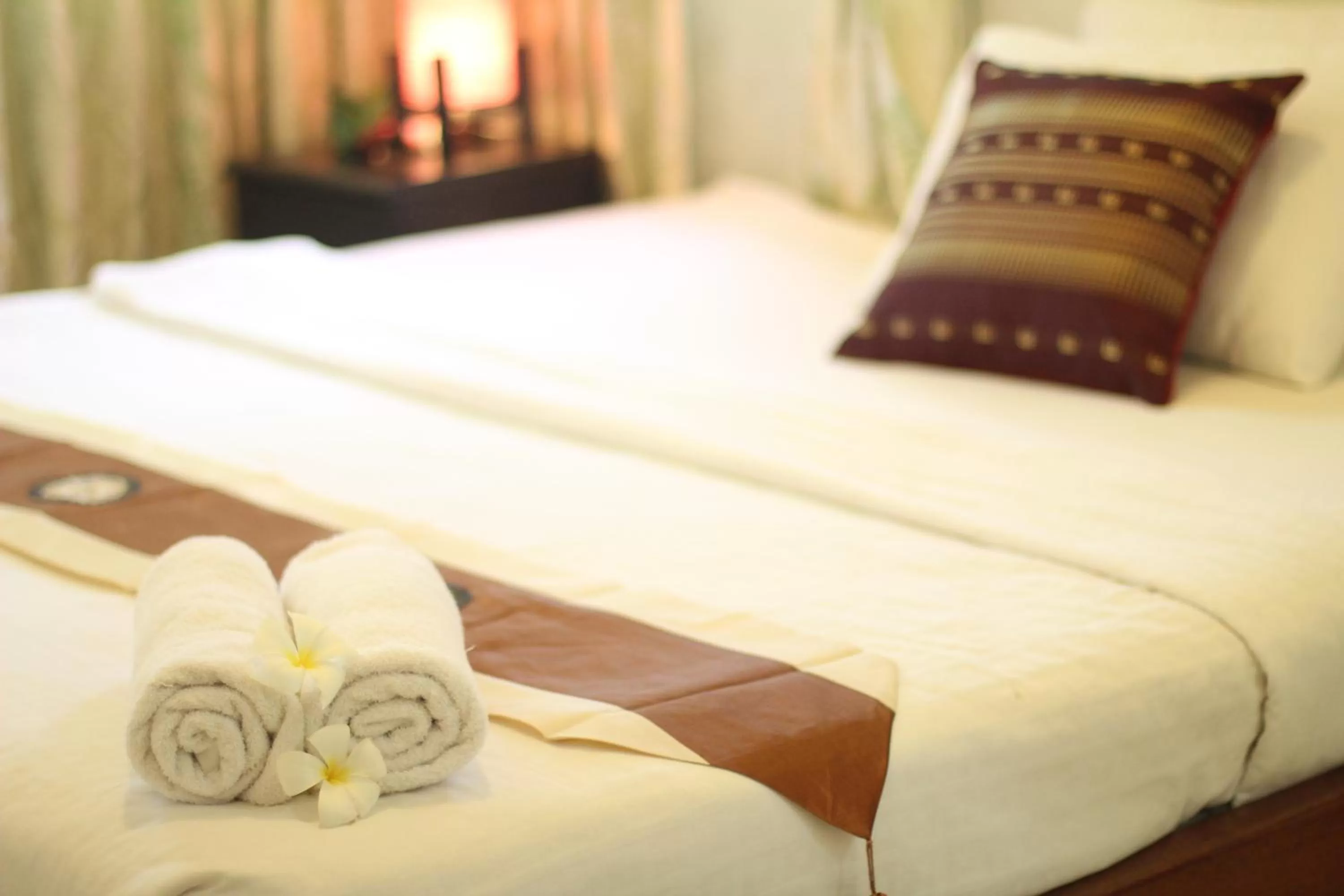 Bed in New Season Riverside Hotel