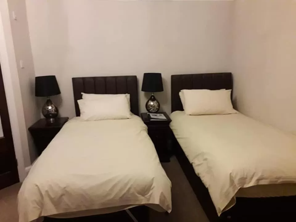 Bed in Brass Castle Country House Accommodation