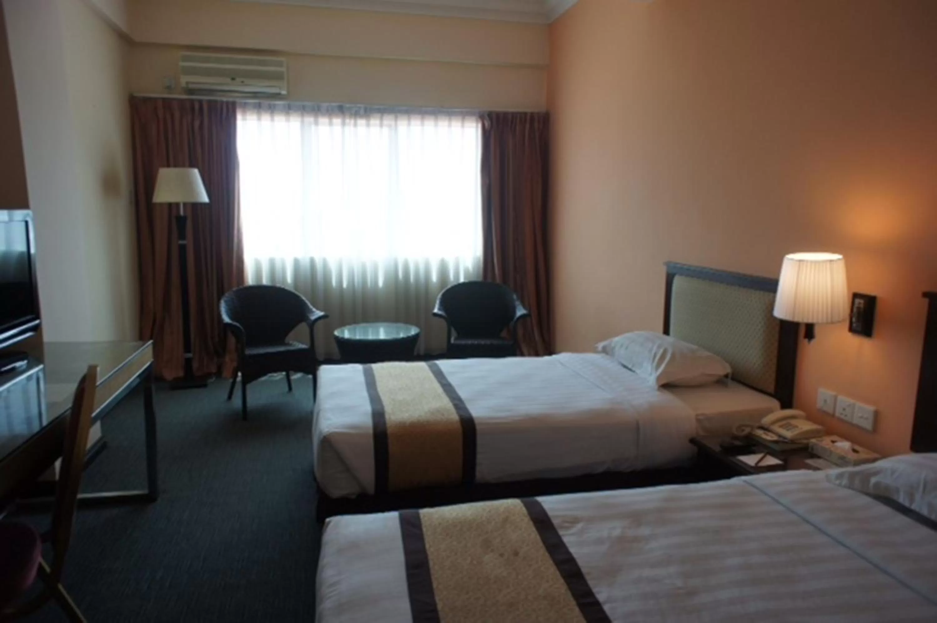 Bed in Tyng Garden Hotel