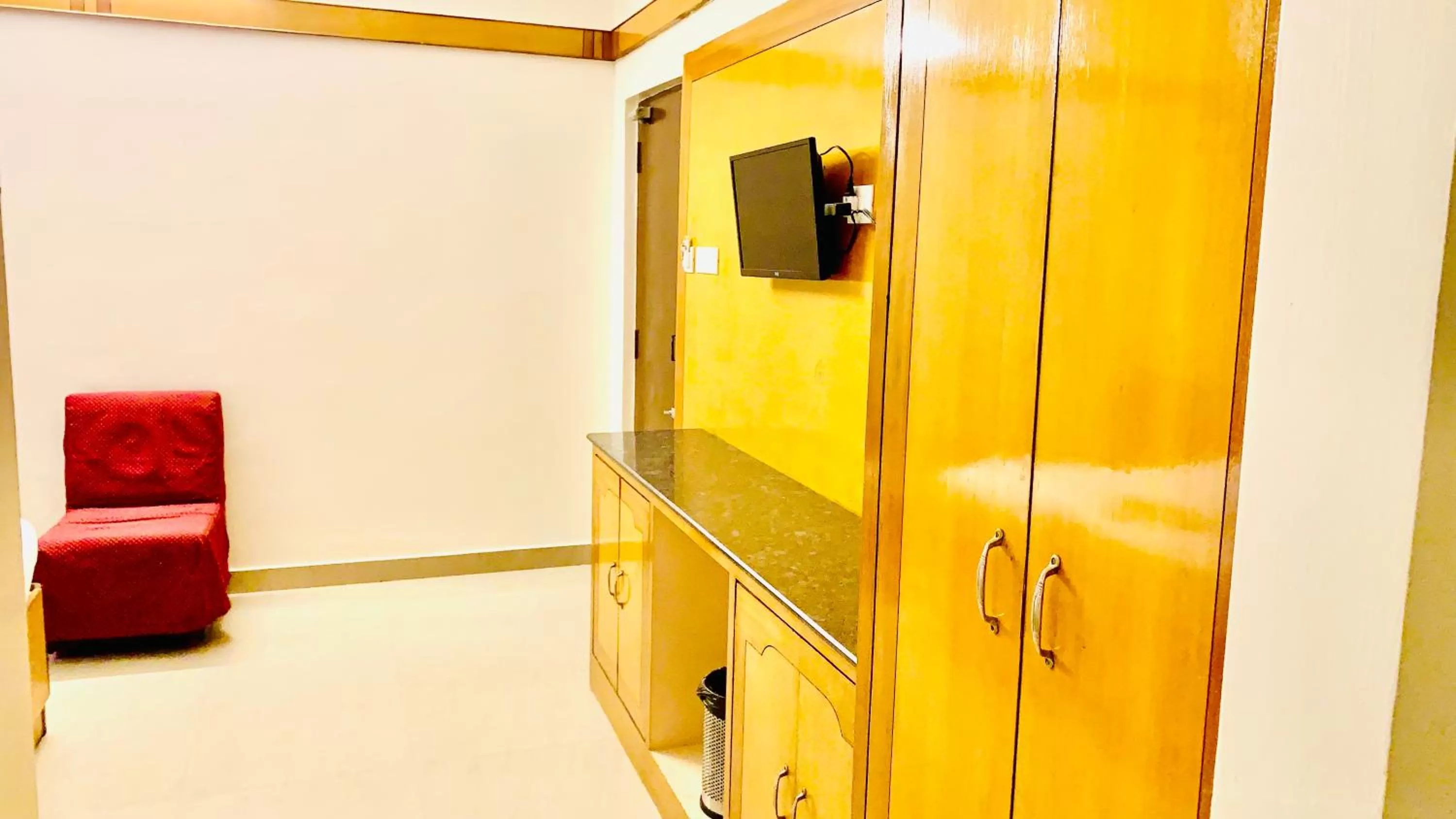 Communal lounge/ TV room in Half Moon Palace Chennai