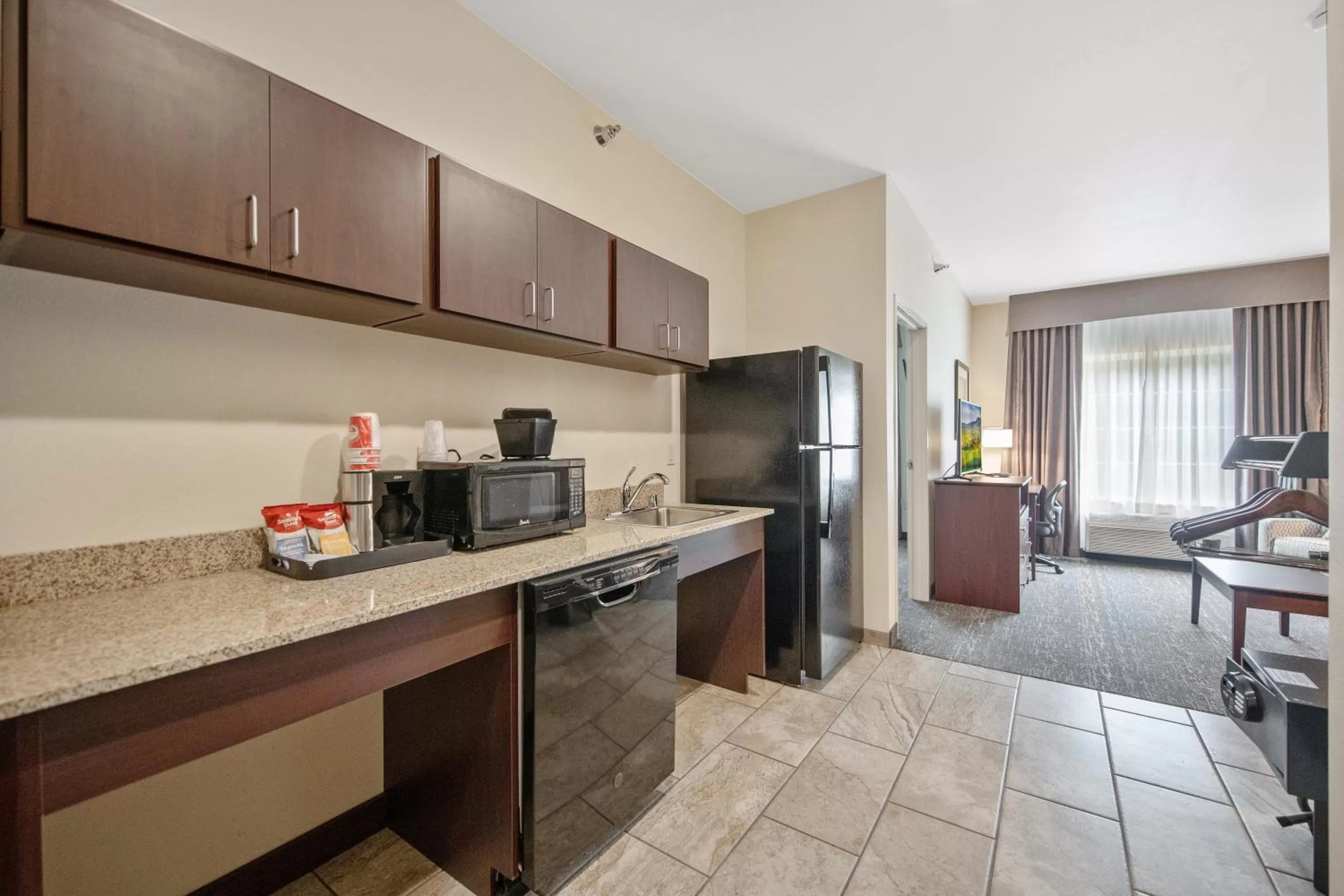 Kitchen or kitchenette in Cobblestone Hotel & Suites - Austin