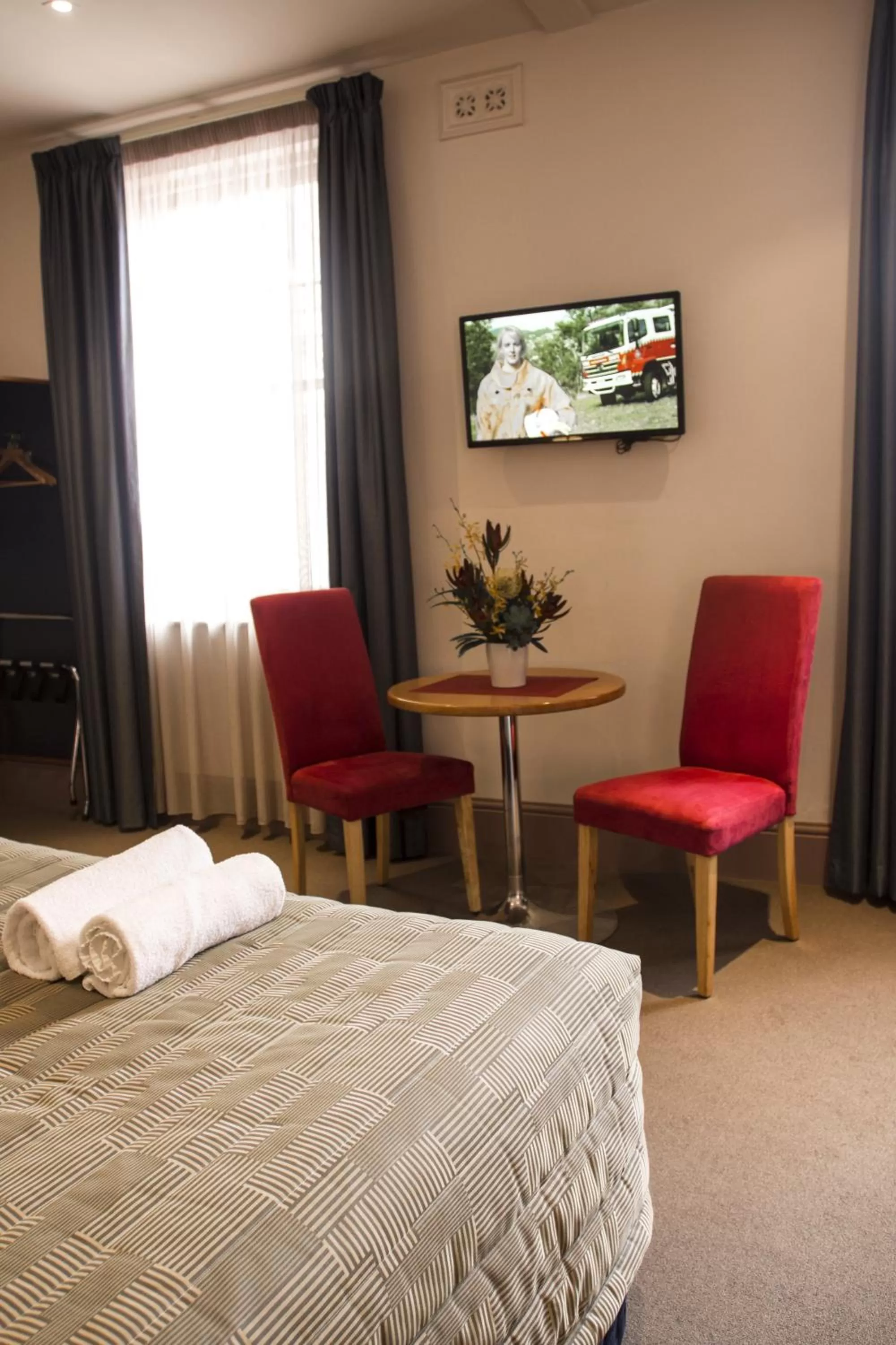 Seating area, Bed in Central Hotel Hobart