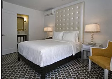 Bed in L.A. Sky Boutique Hotel