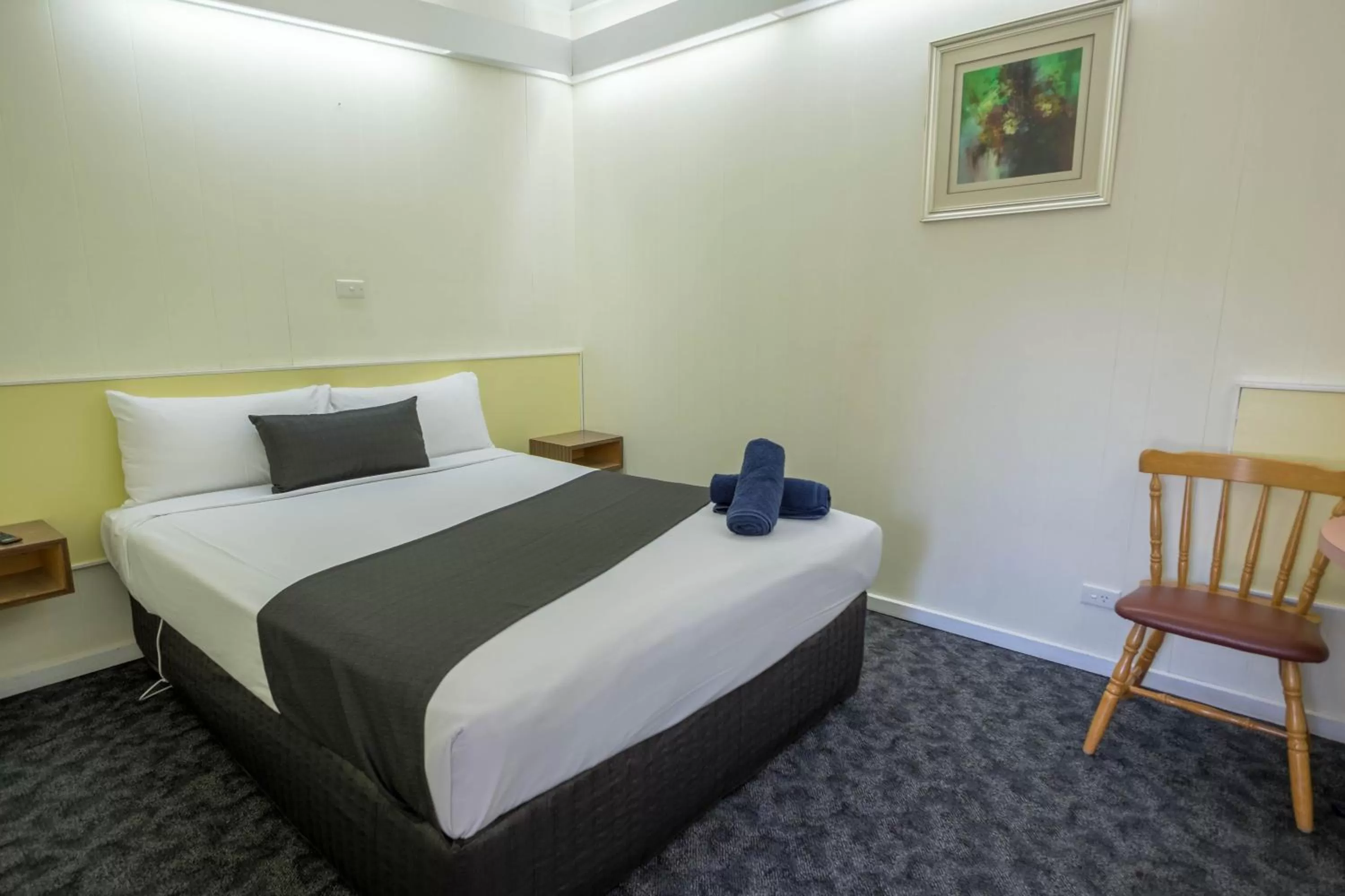 Bed in Pioneer Station Motor Inn