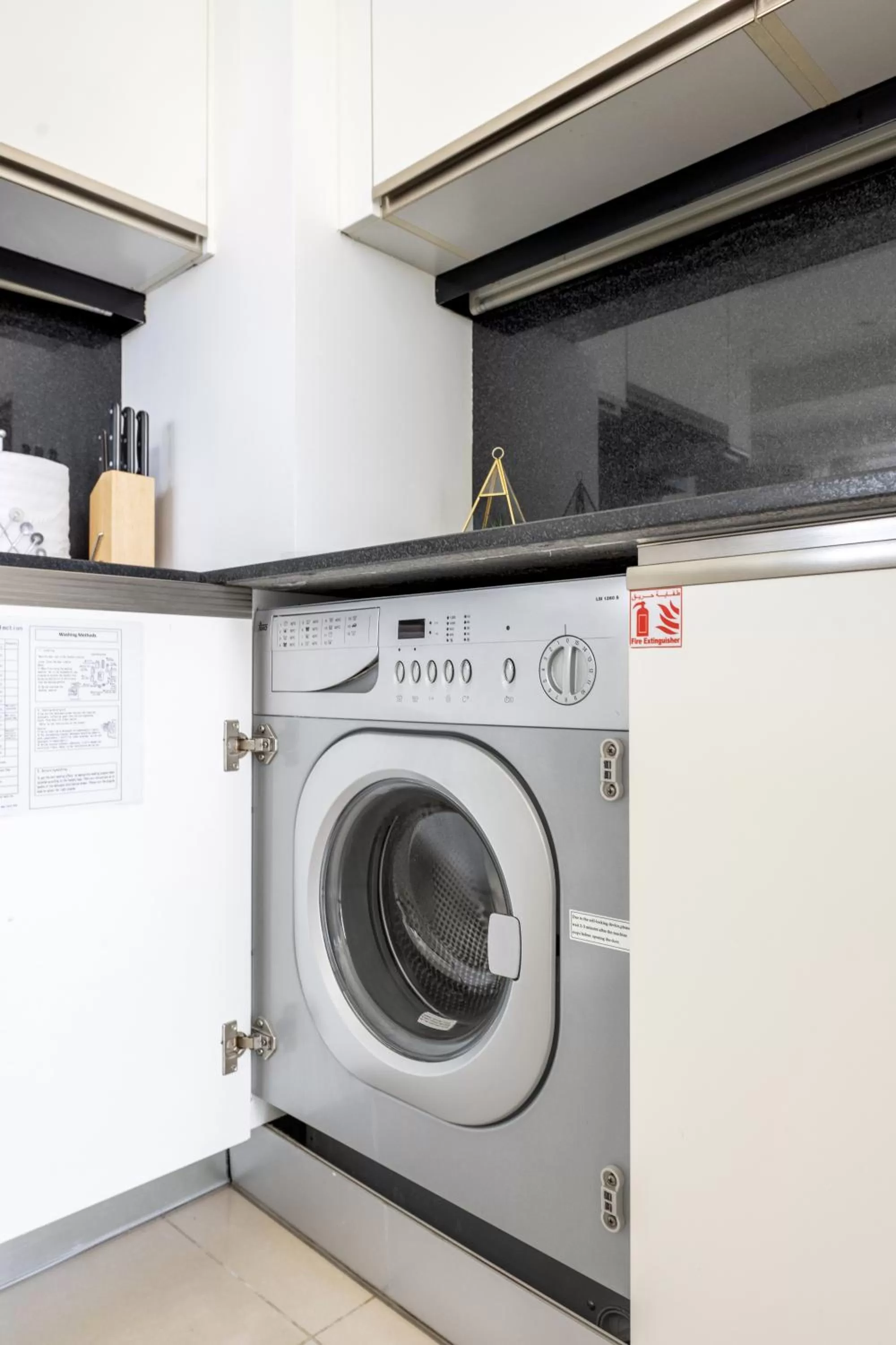 washing machine in Emaar Residences Dubai Marina by Qstay - formerly Address Dubai Marina