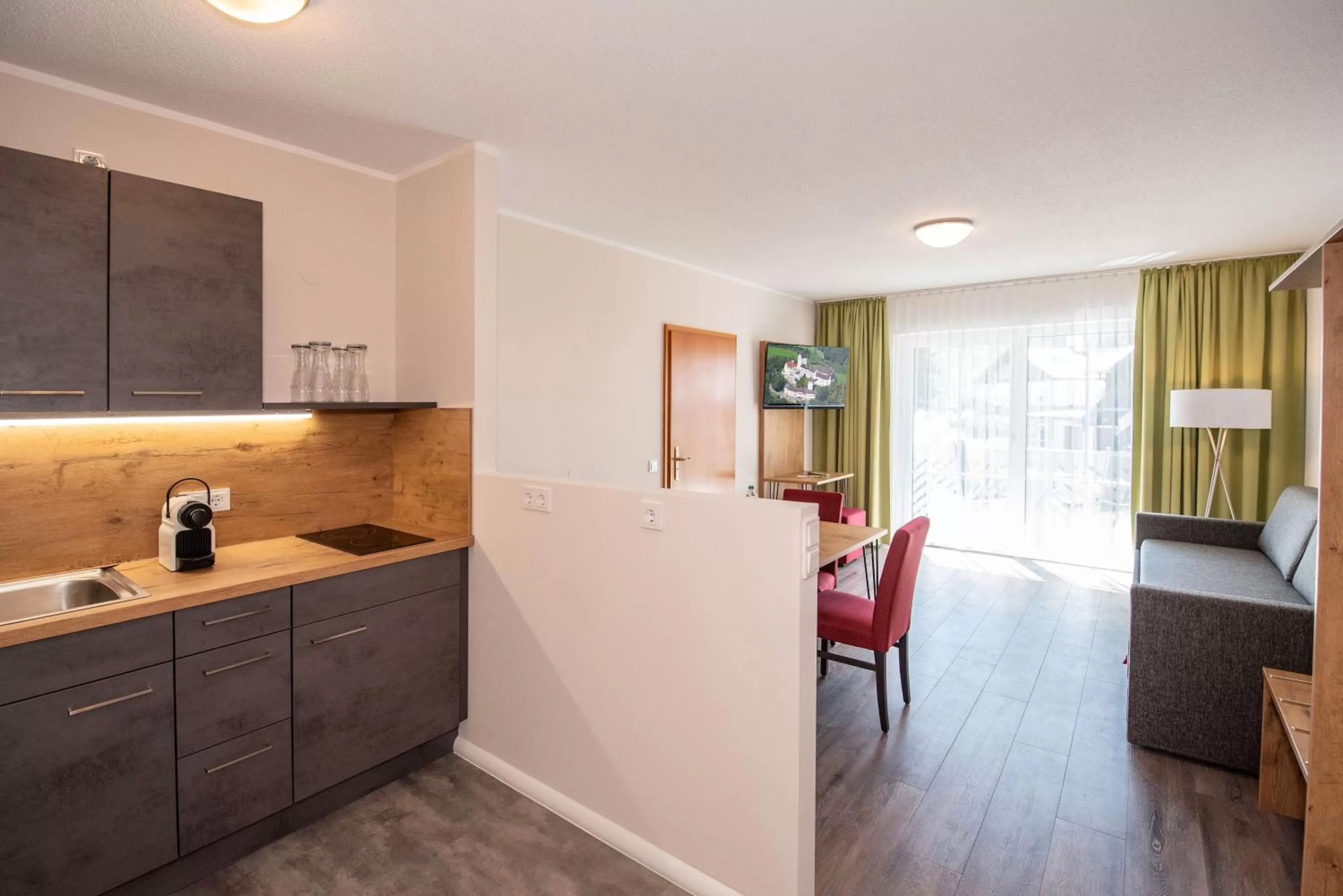 Living room, Kitchen/Kitchenette in Hotel Hohenaschau