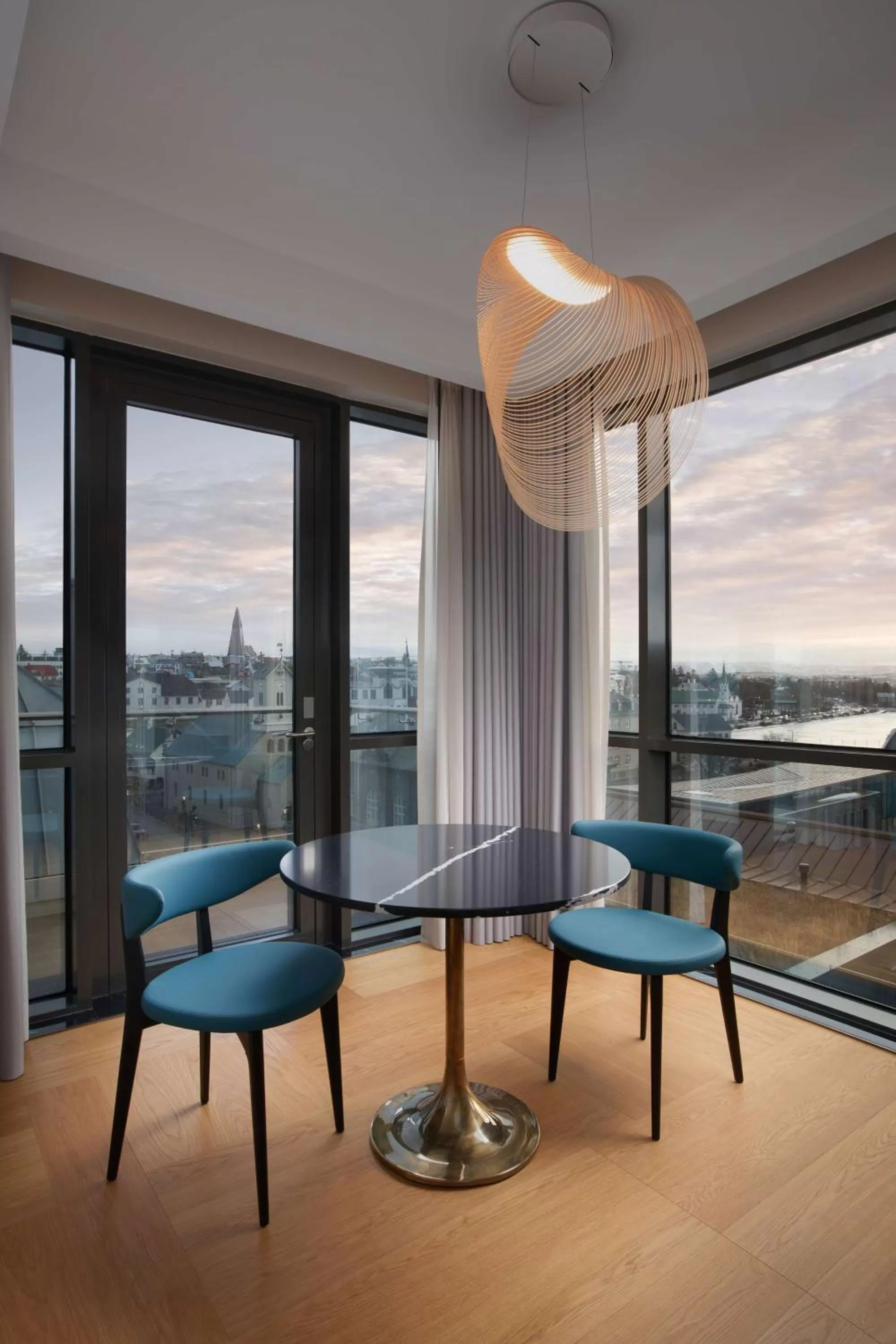 Living room in Iceland Parliament Hotel, Curio Collection By Hilton