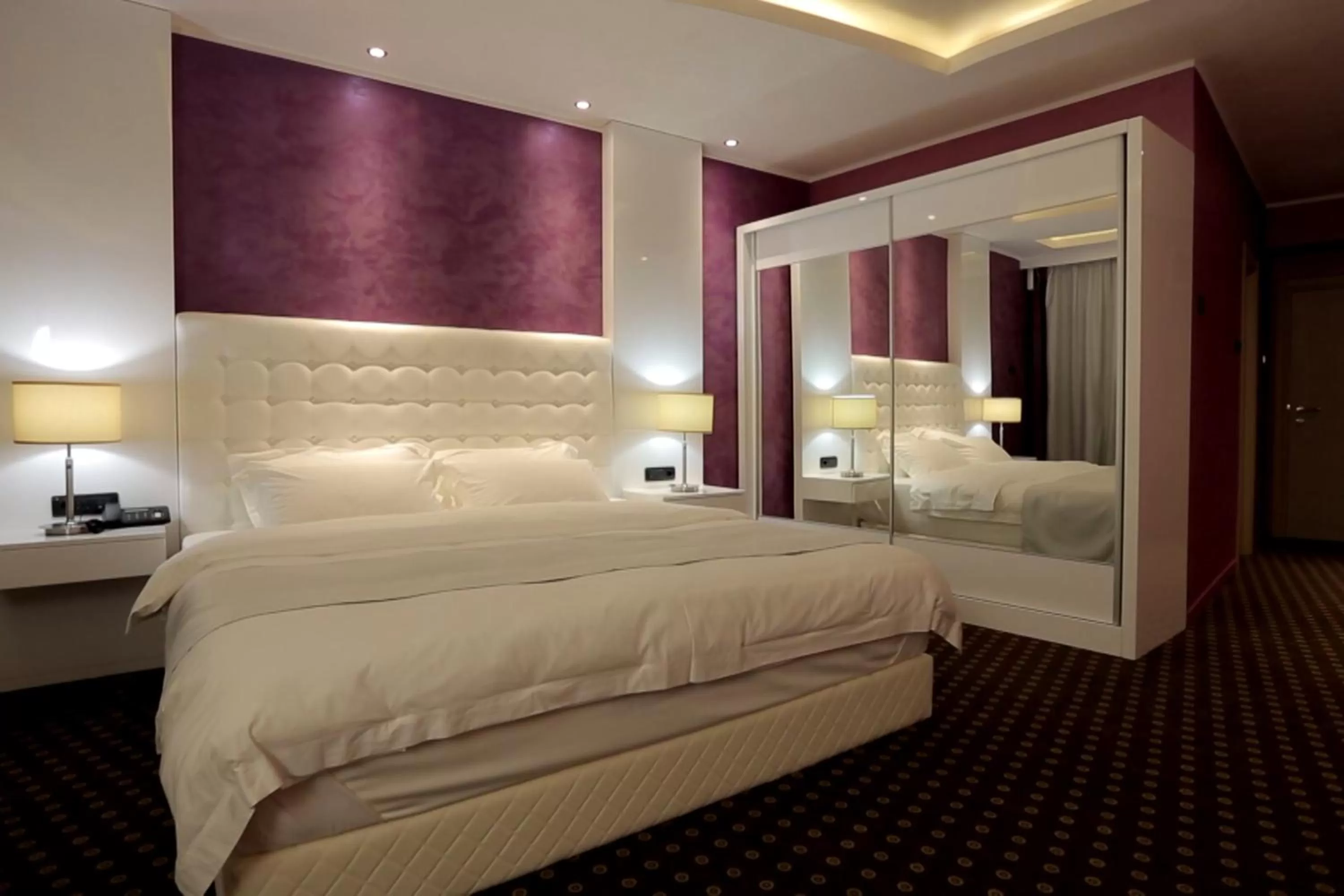 Bed in Orbis Design Hotel & Spa