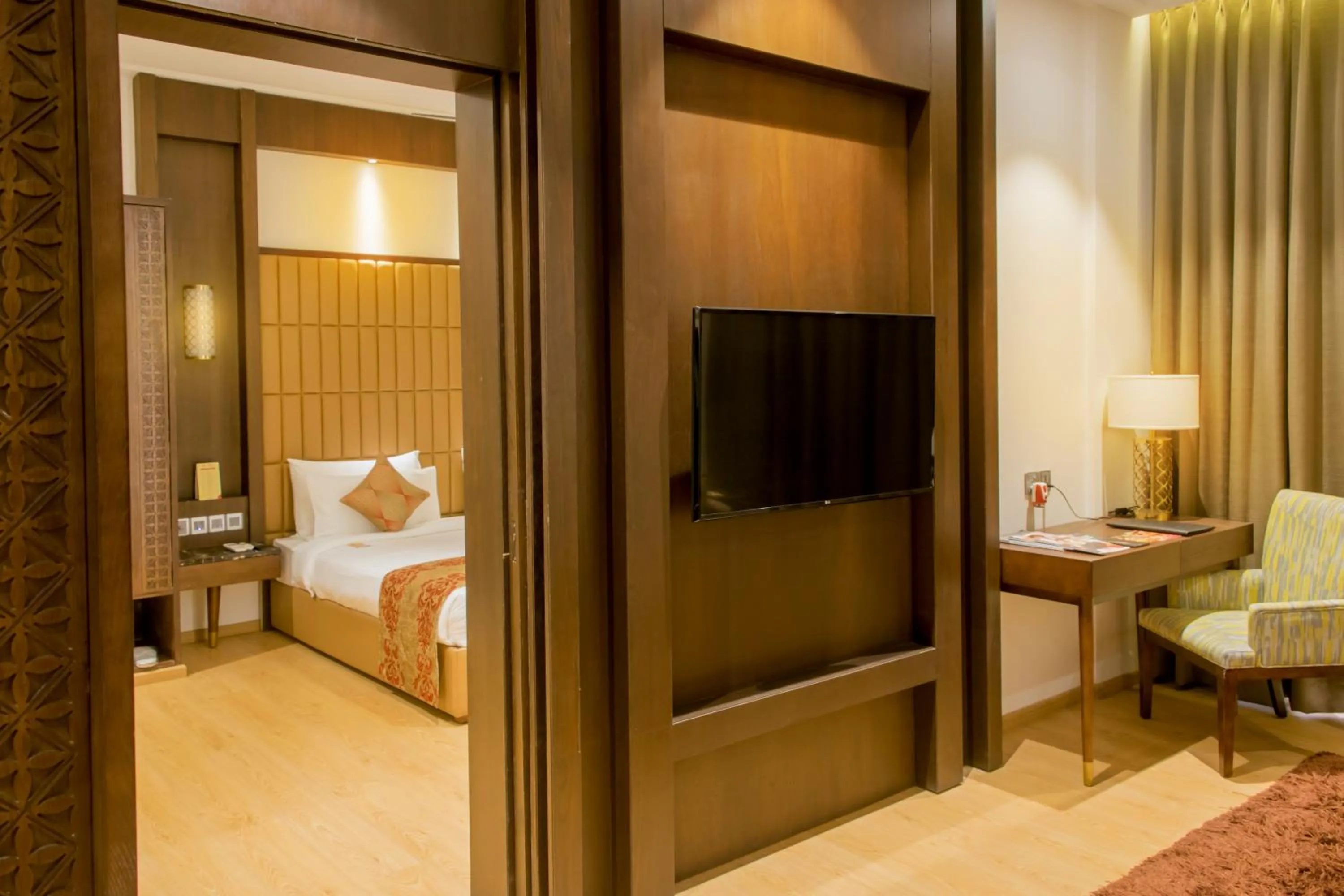 Communal lounge/ TV room, Bed in The Corinthians Resort