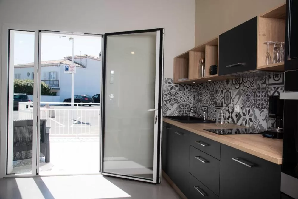 Kitchen or kitchenette in Hotel Les Dunes