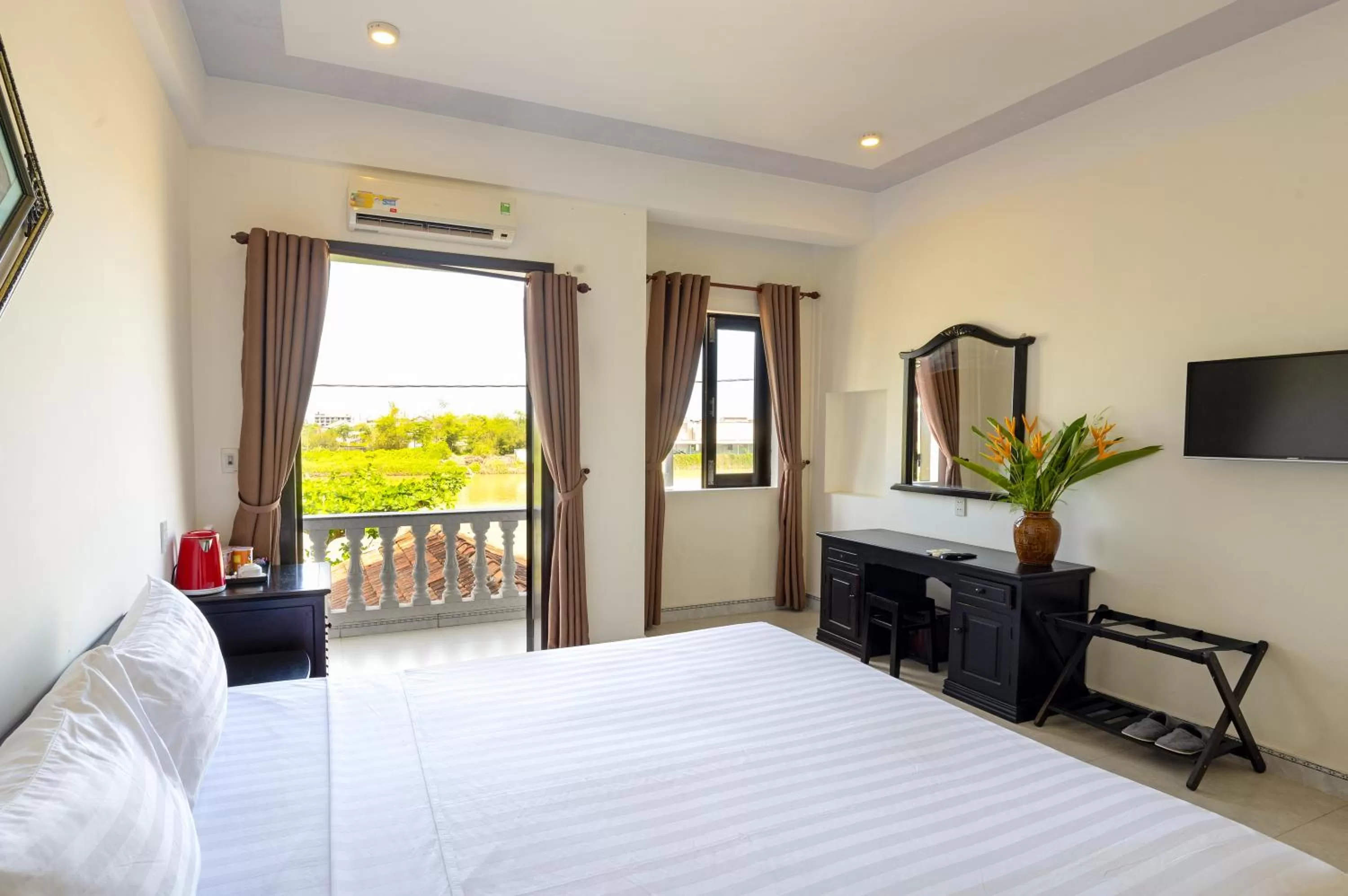Photo of the whole room, Bed in Blue River Boutique Hoi An Hotel