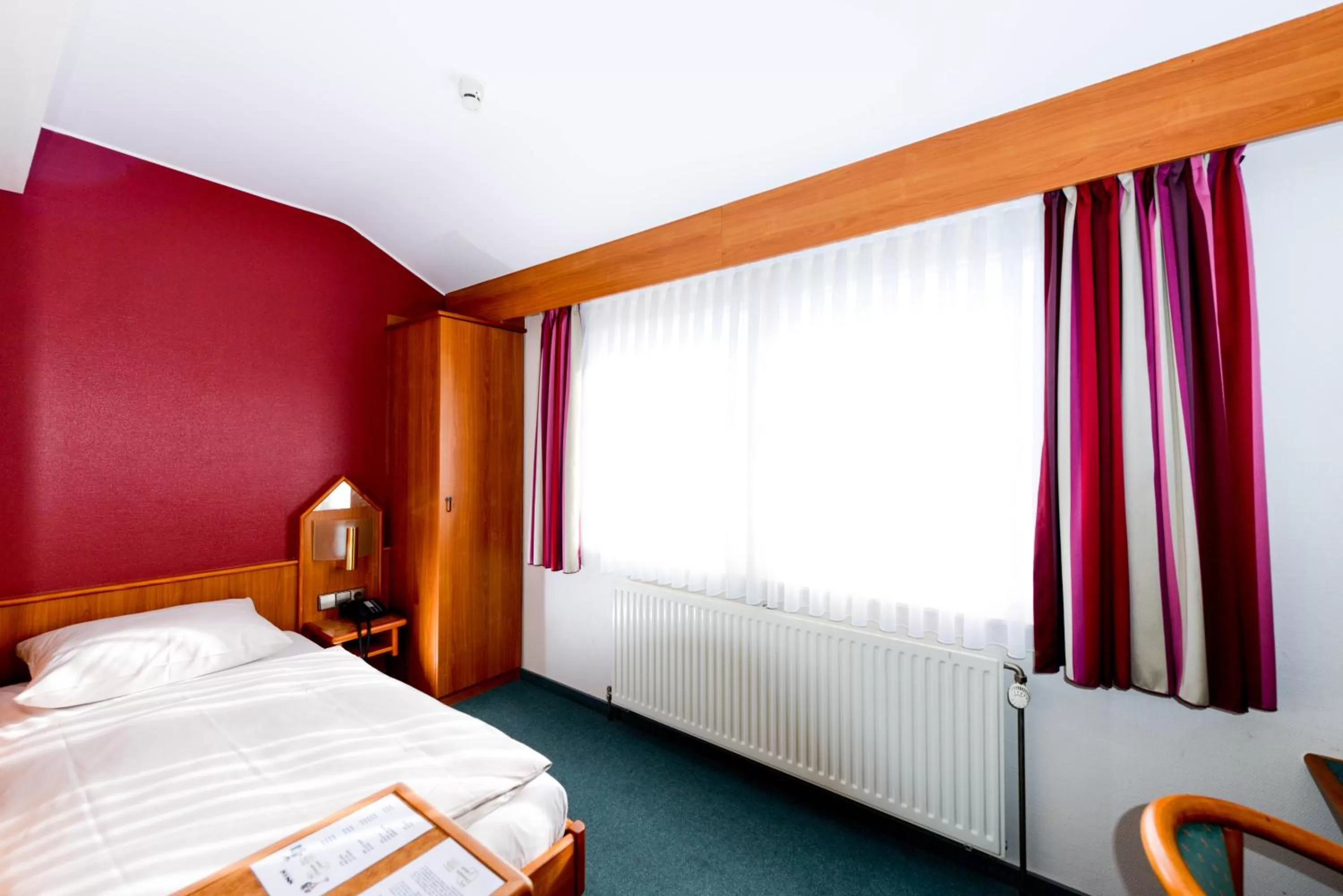 Seating area, Bed in Hotel Christophe Colomb