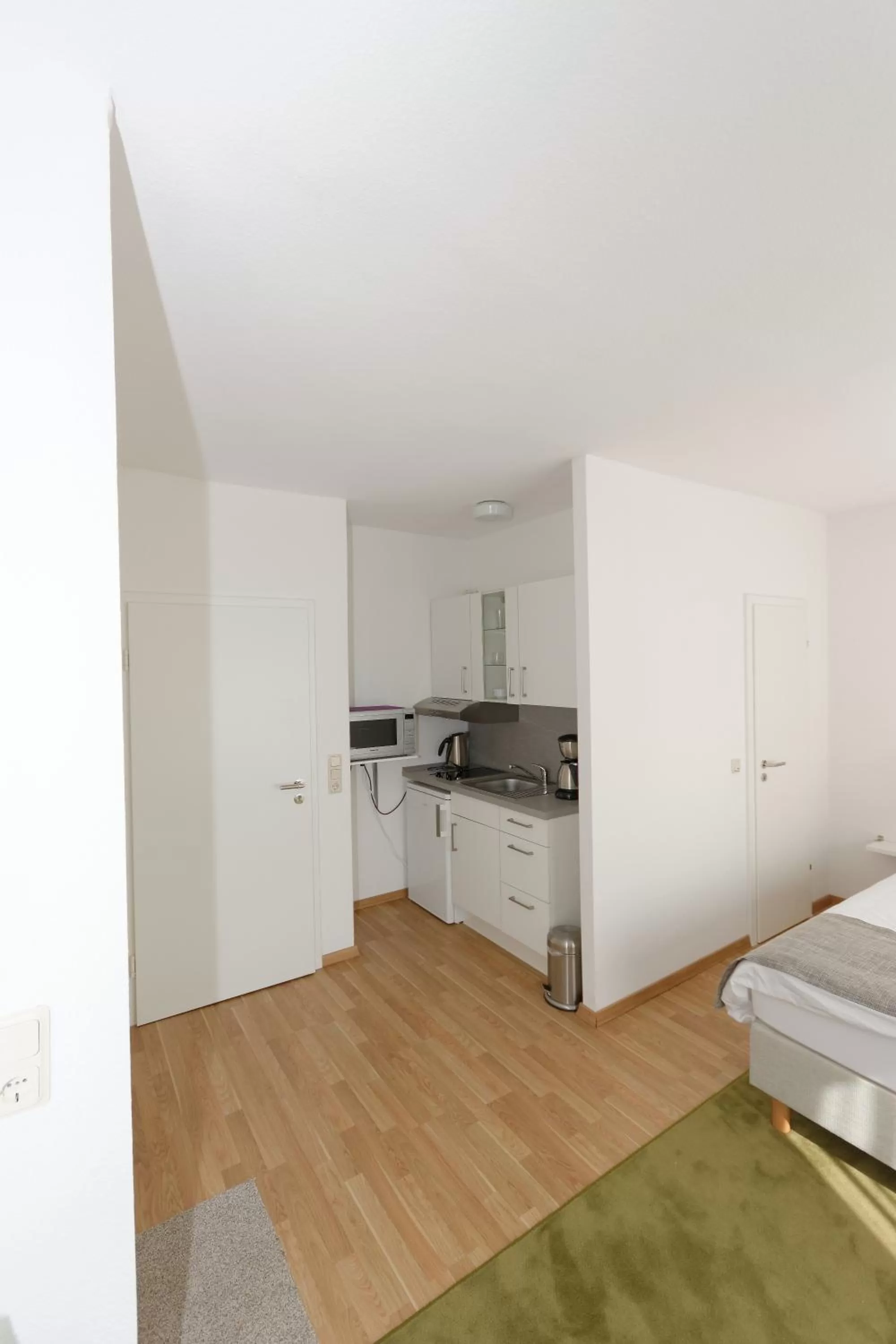 Kitchen or kitchenette, Bed in Aparthotel Stoll