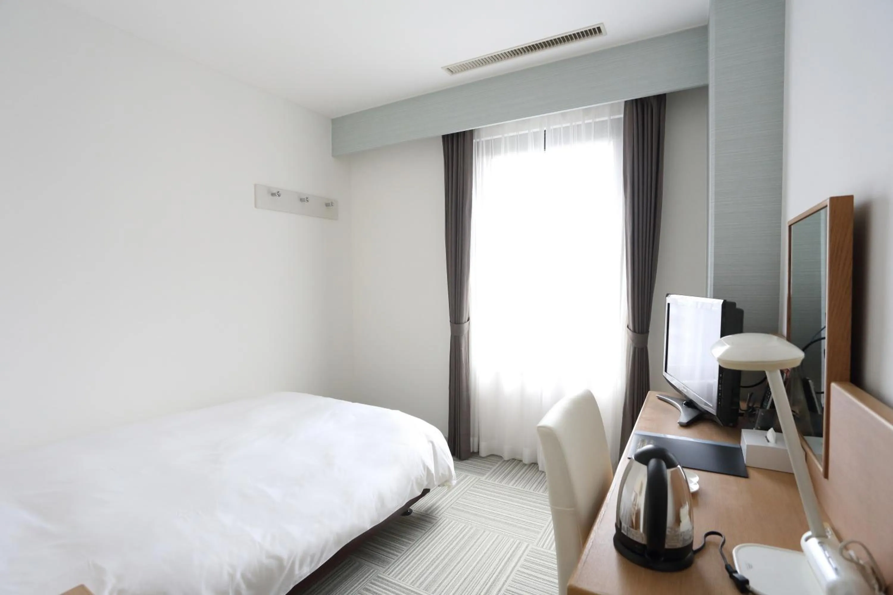 Bed in Hotel International House Osaka