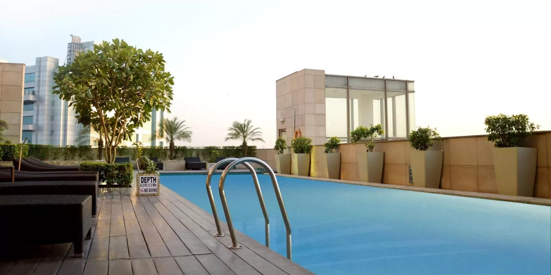 Swimming pool in Crowne Plaza New Delhi Okhla by IHG