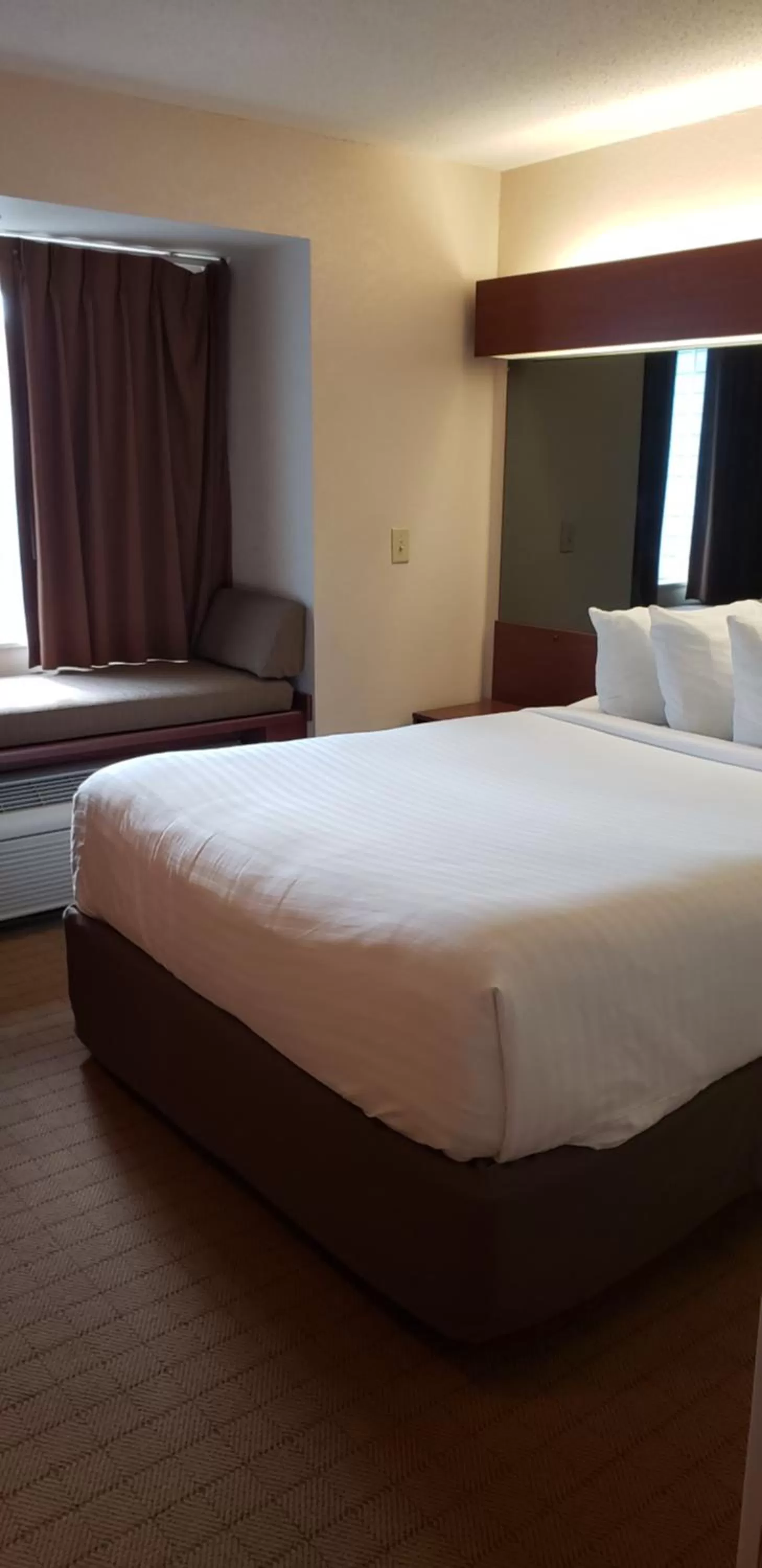 Bed in Microtel Inn & Suites by Wyndham Wellsville