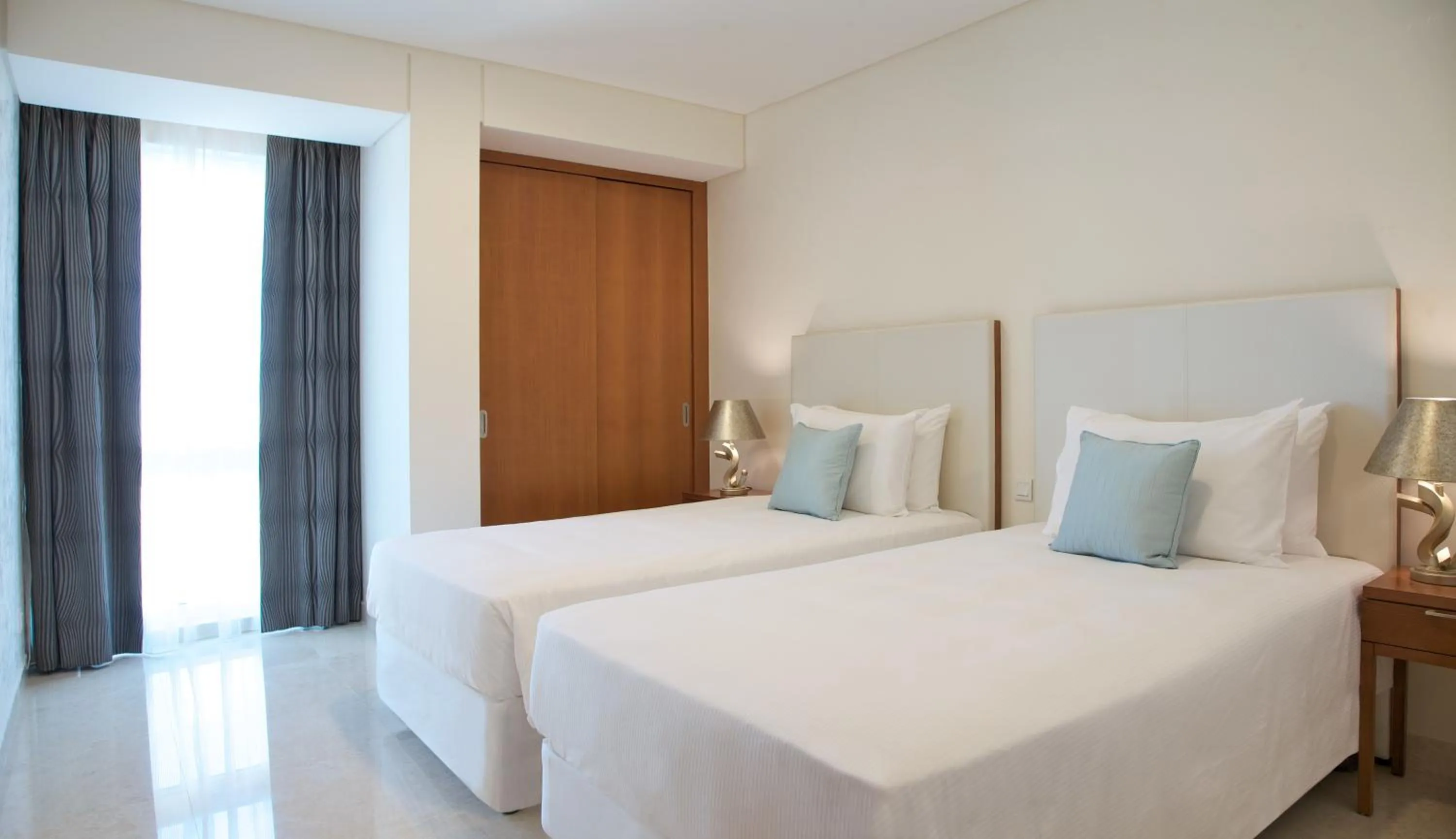 Bedroom in Millennium Executive Apartments Muscat