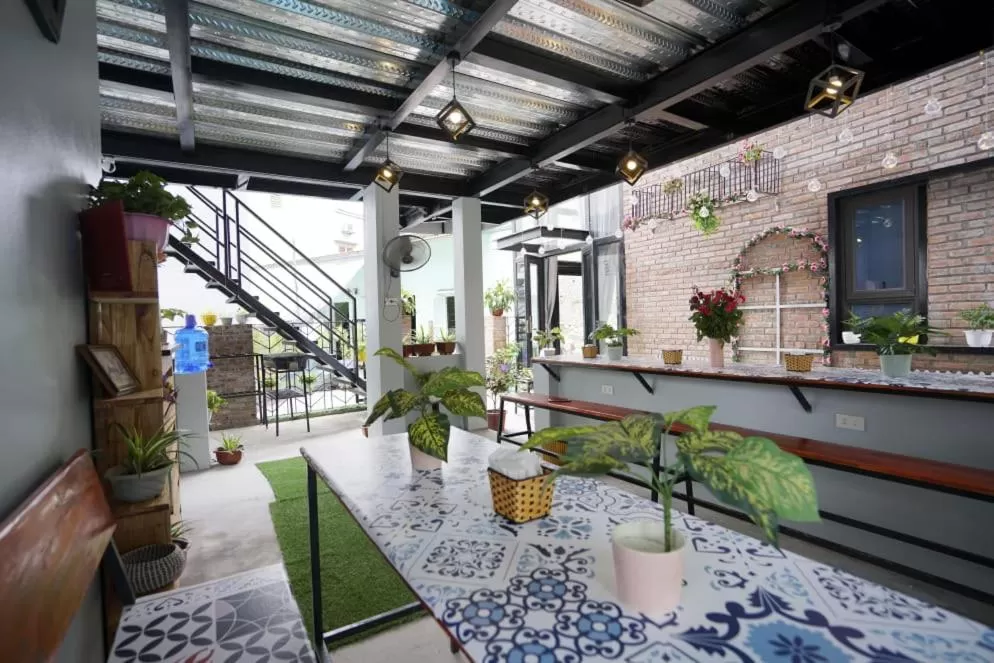 Patio in Almor Hostel With Pool in right center