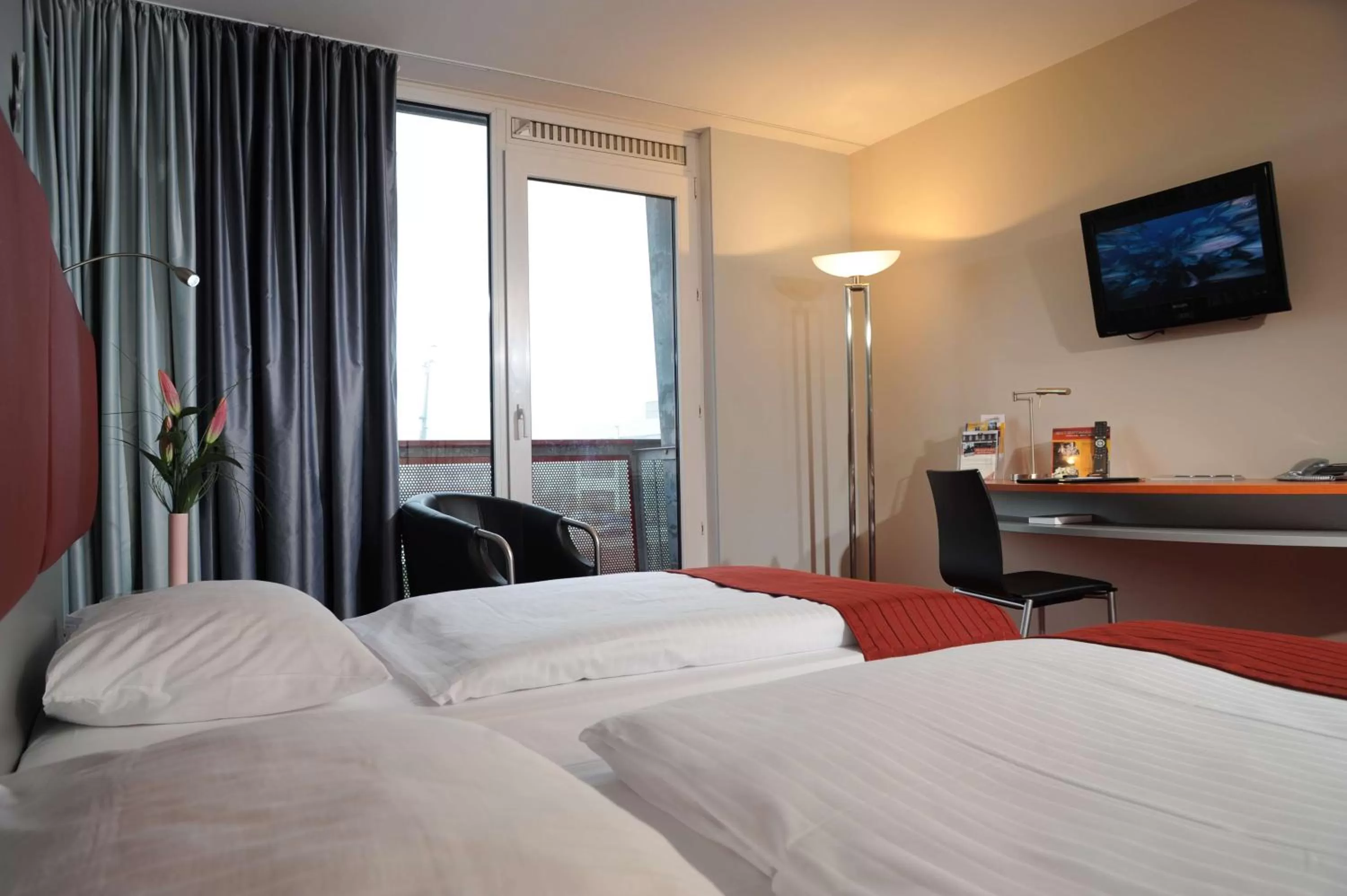 Photo of the whole room, Bed in Nordsee Hotel Fischereihafen