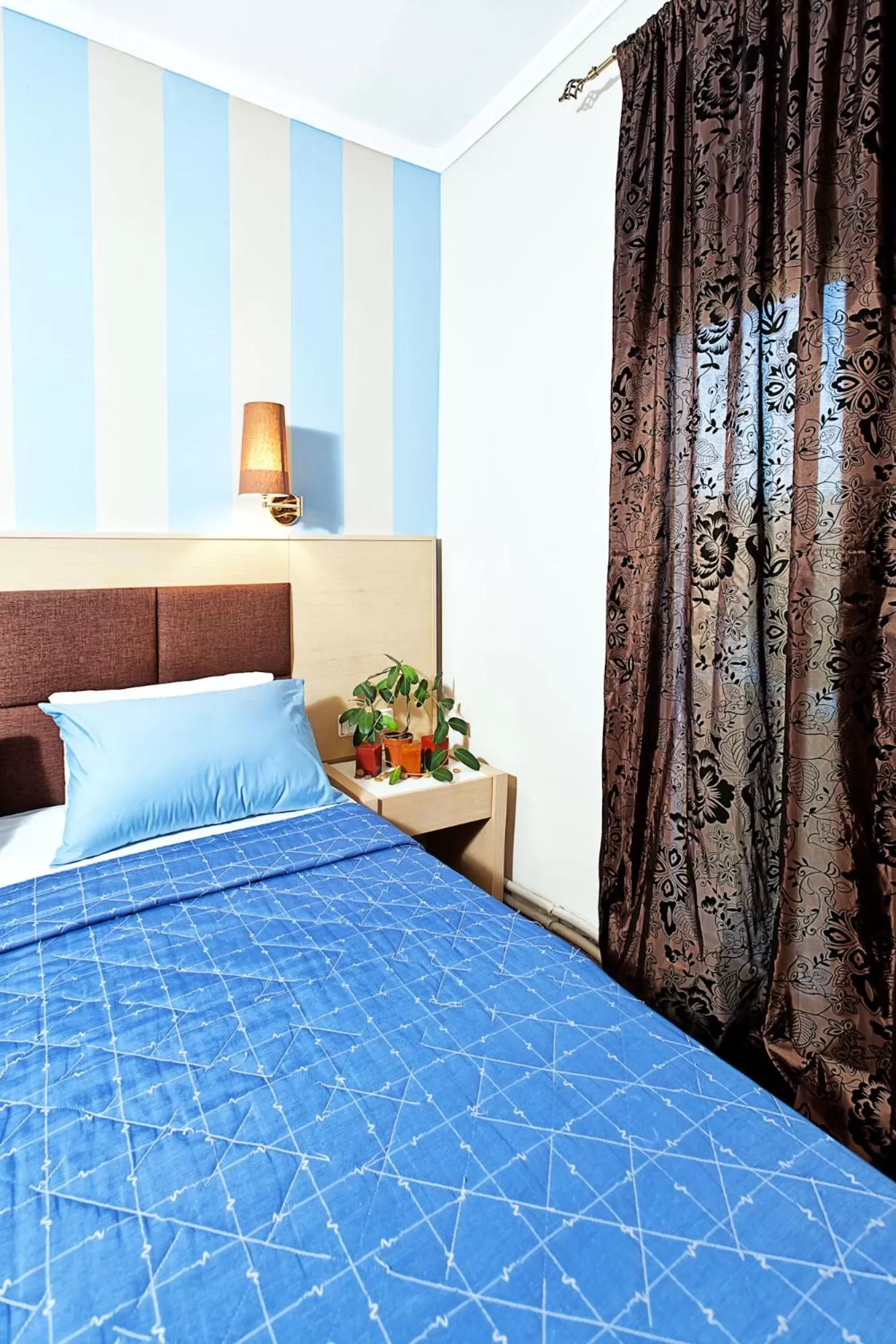 Property building, Bed in Anastassiou Hotel - Bike and motorcycle friendly hotel