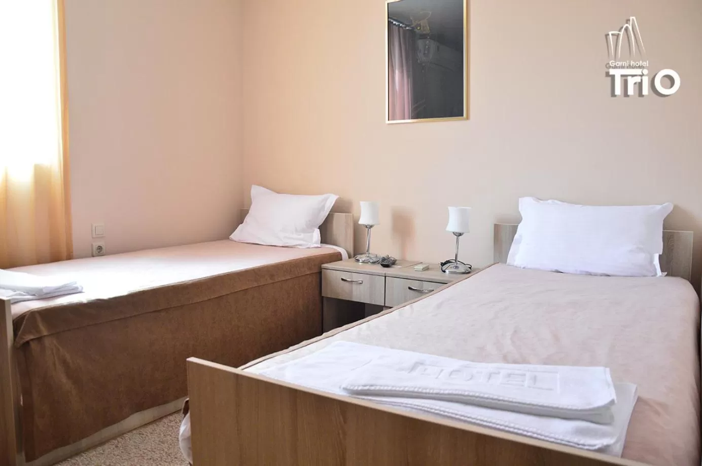 Bed in Garni Hotel Tri O