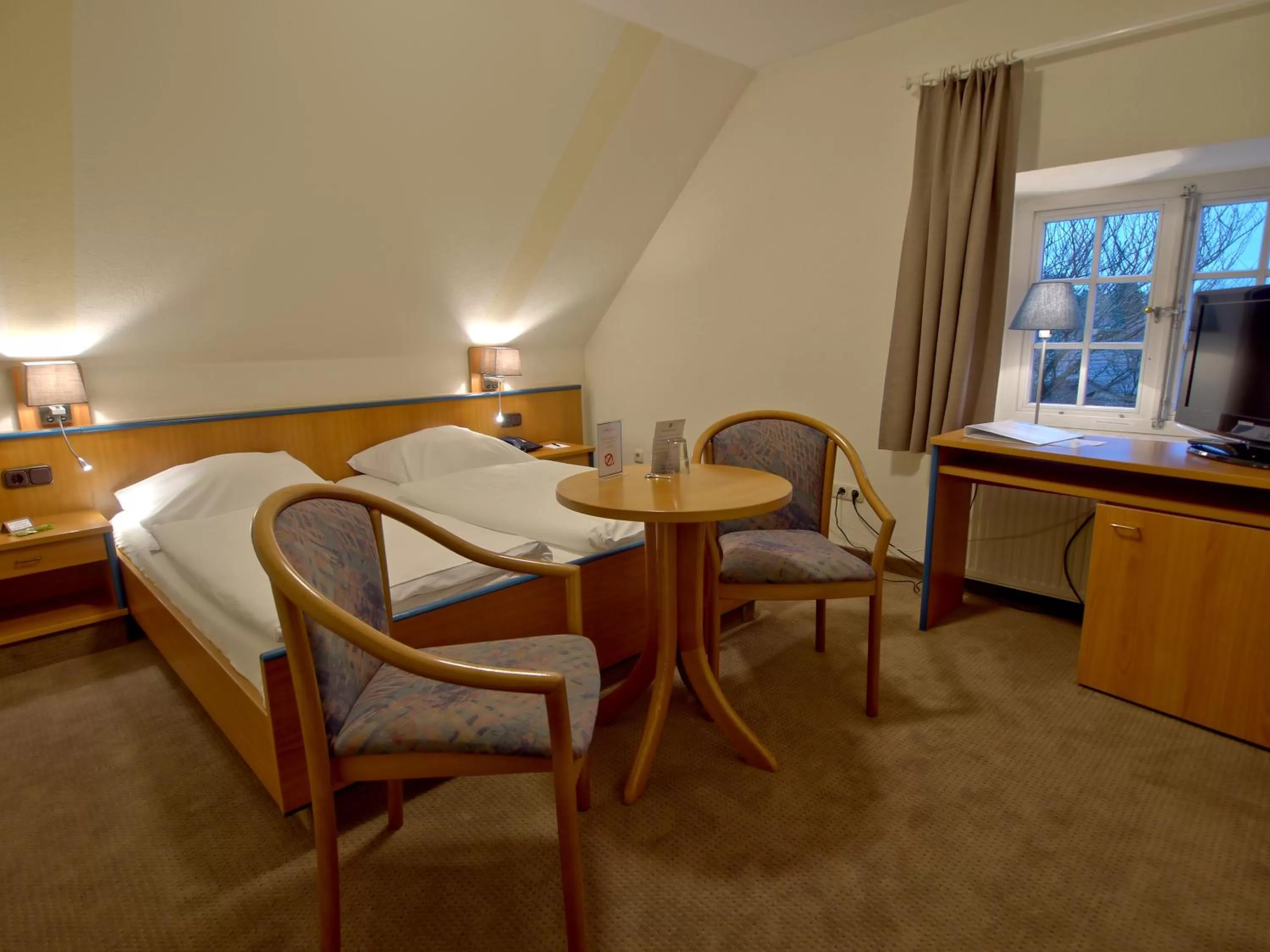 Bed in Hotel Friesische Wehde