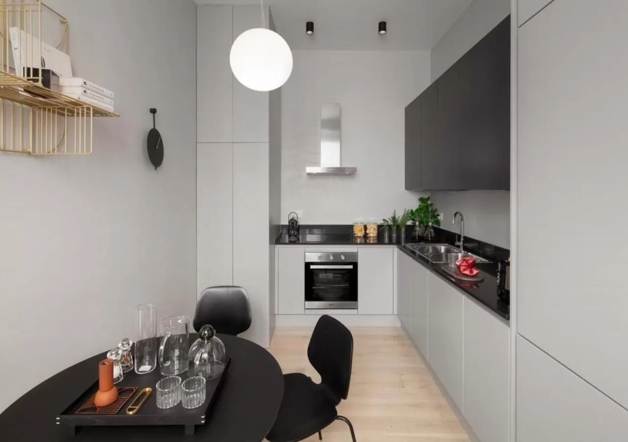 Kitchen or kitchenette in BB Hotels Aparthotel Collection Il Michelangelo