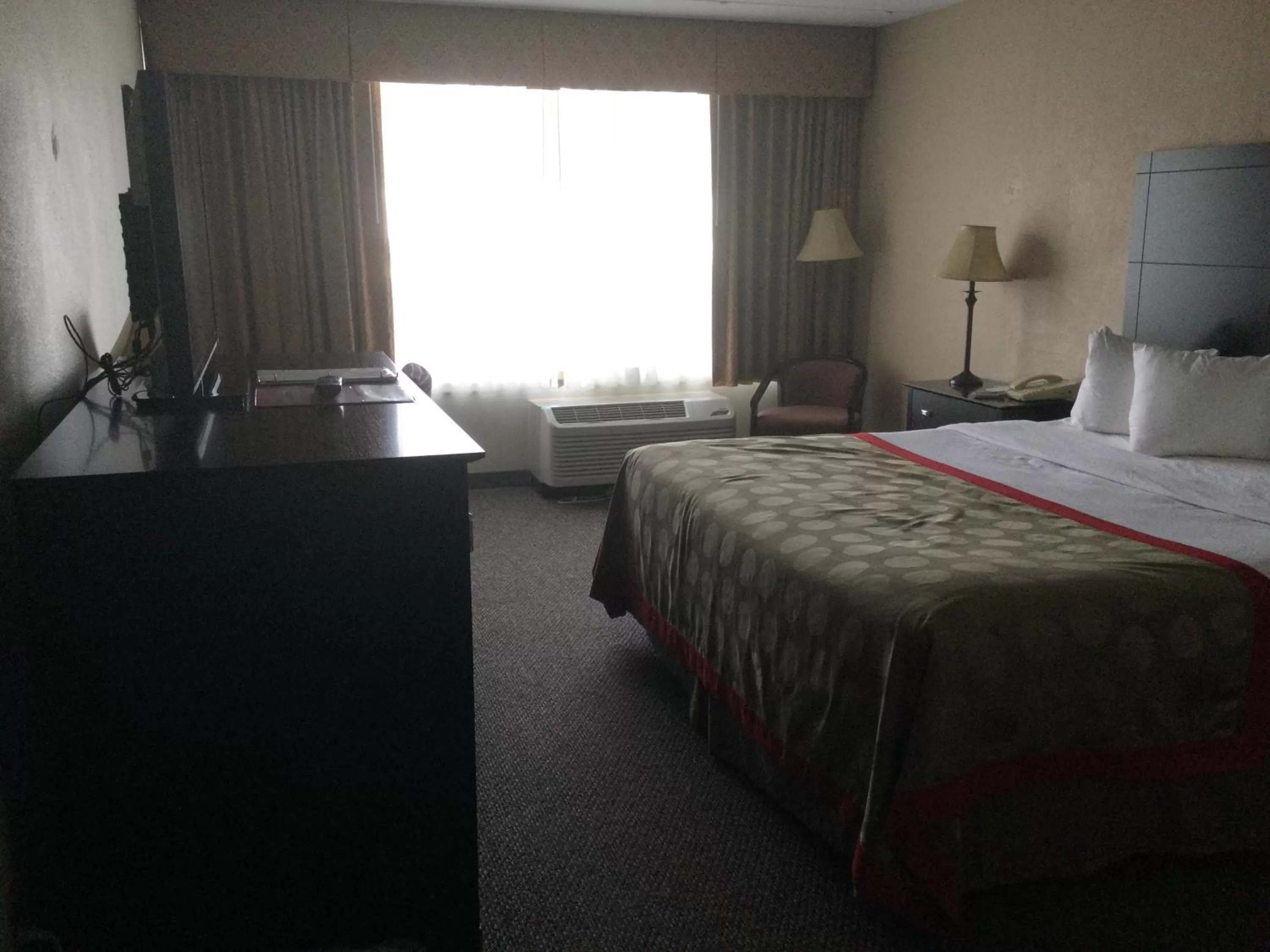 Bed in Ramada by Wyndham Grayling Hotel & Conference Center