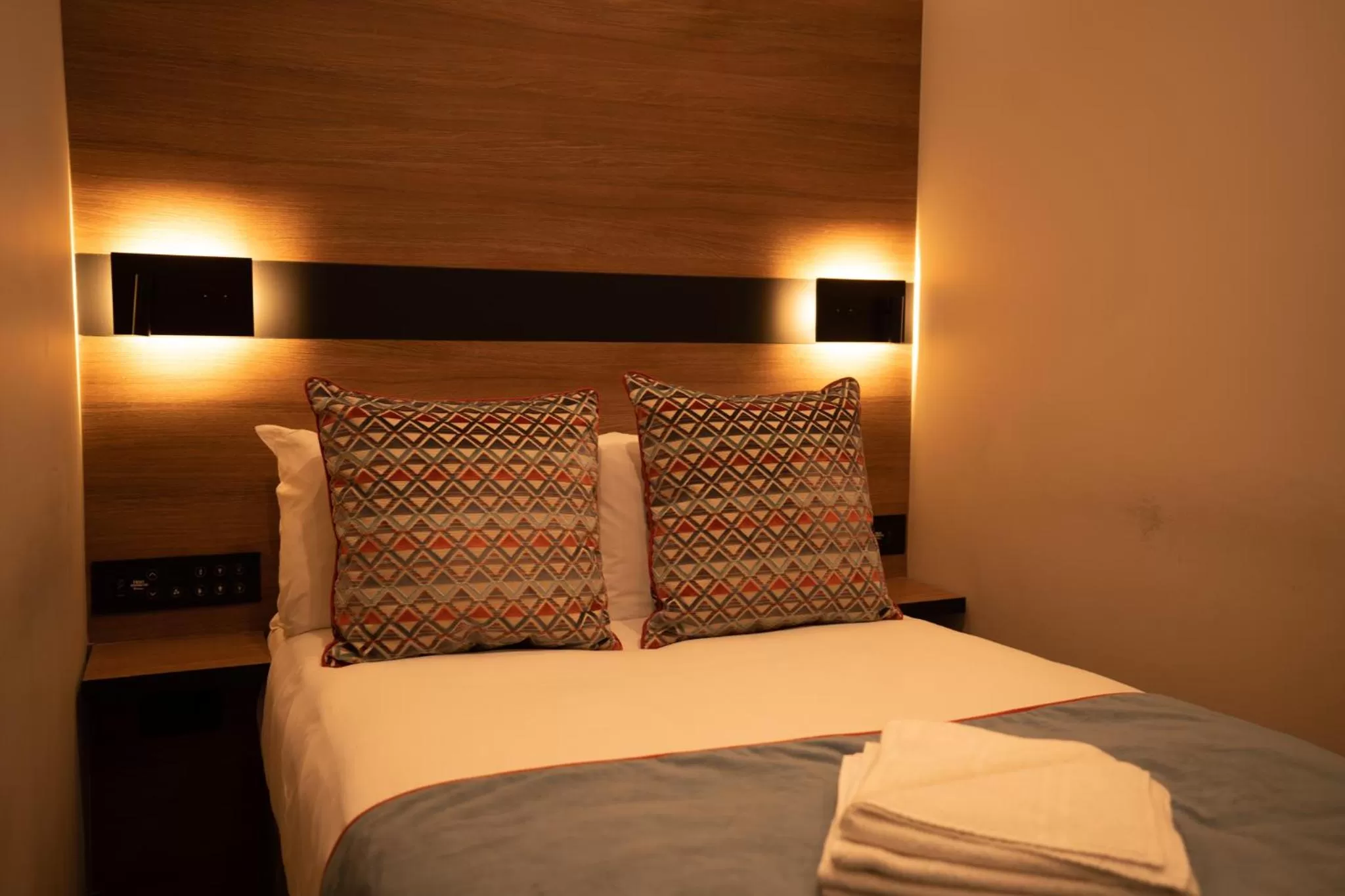 Bed in Merit Kensington Hotel