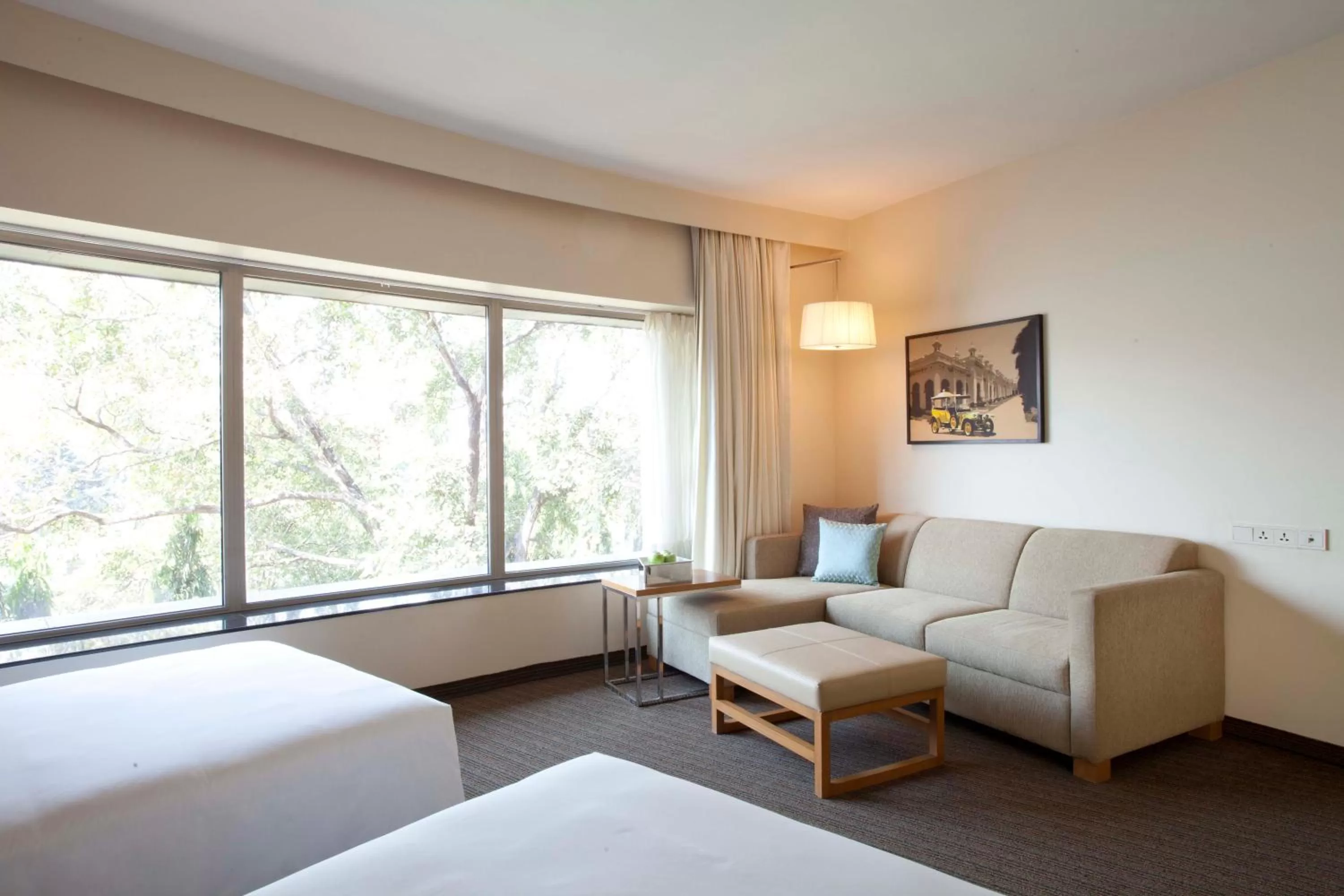 Seating area, Bed in Hyatt Place Hyderabad Banjara Hills