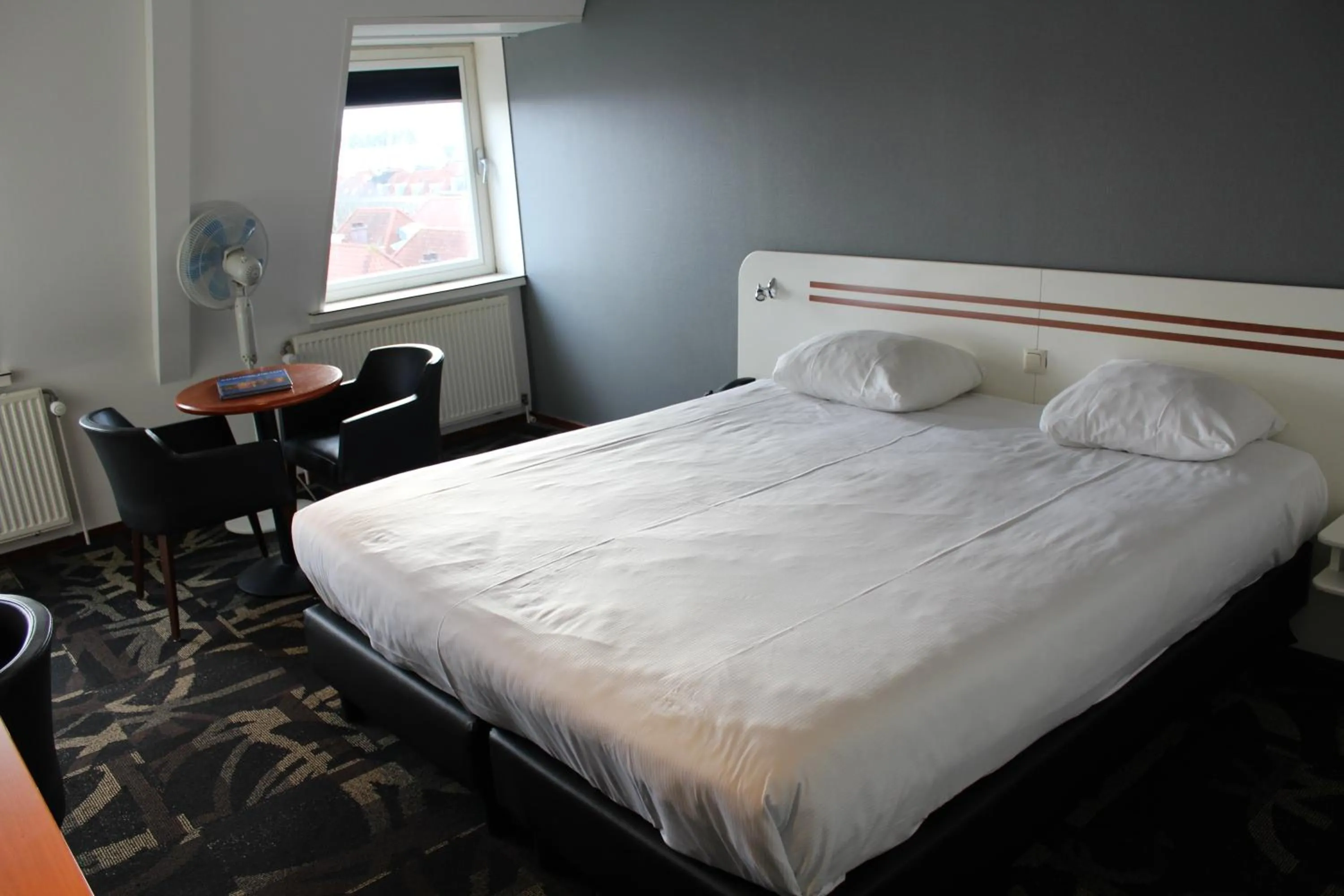 Bed in Fletcher Stadshotel Den Haag