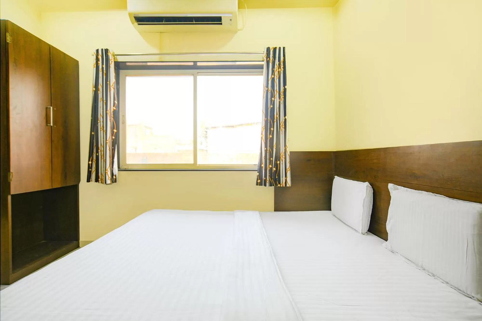 Bed in FabHotel Satyug Jaisinghpura