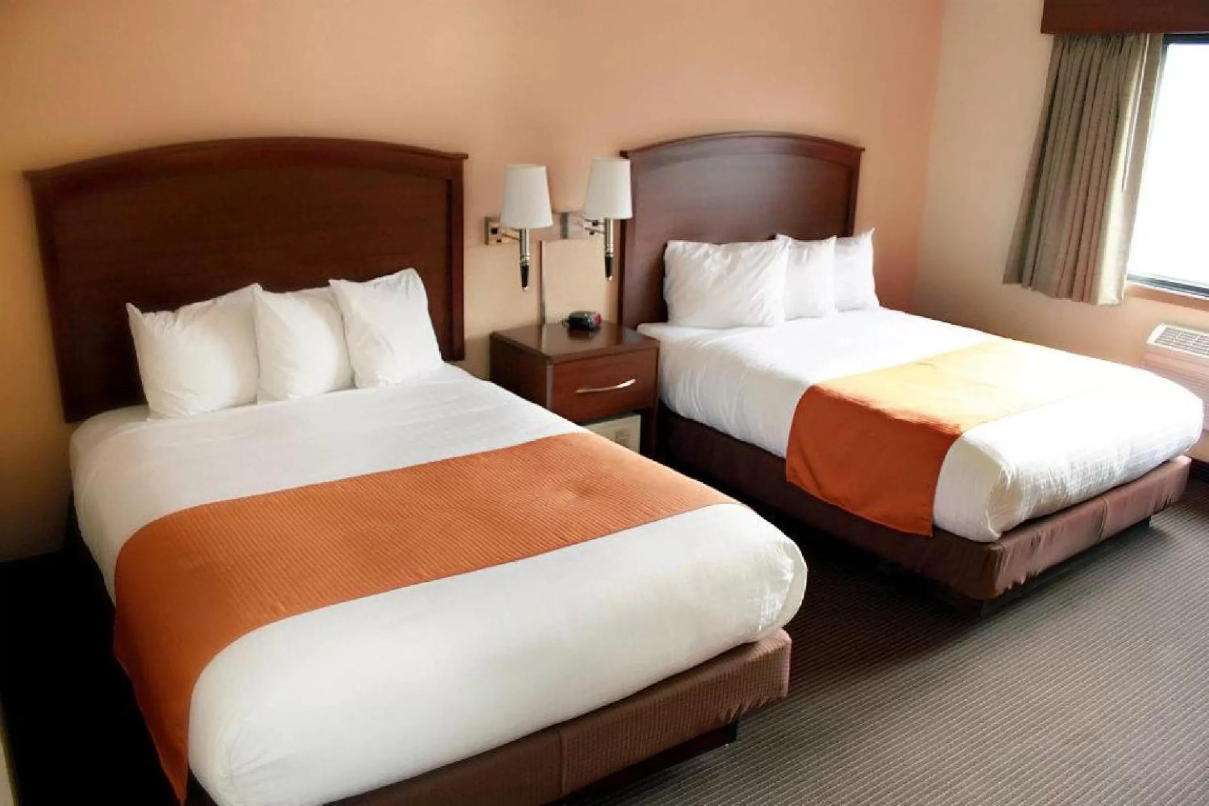 Bed in AmericInn by Wyndham Fargo West Acres