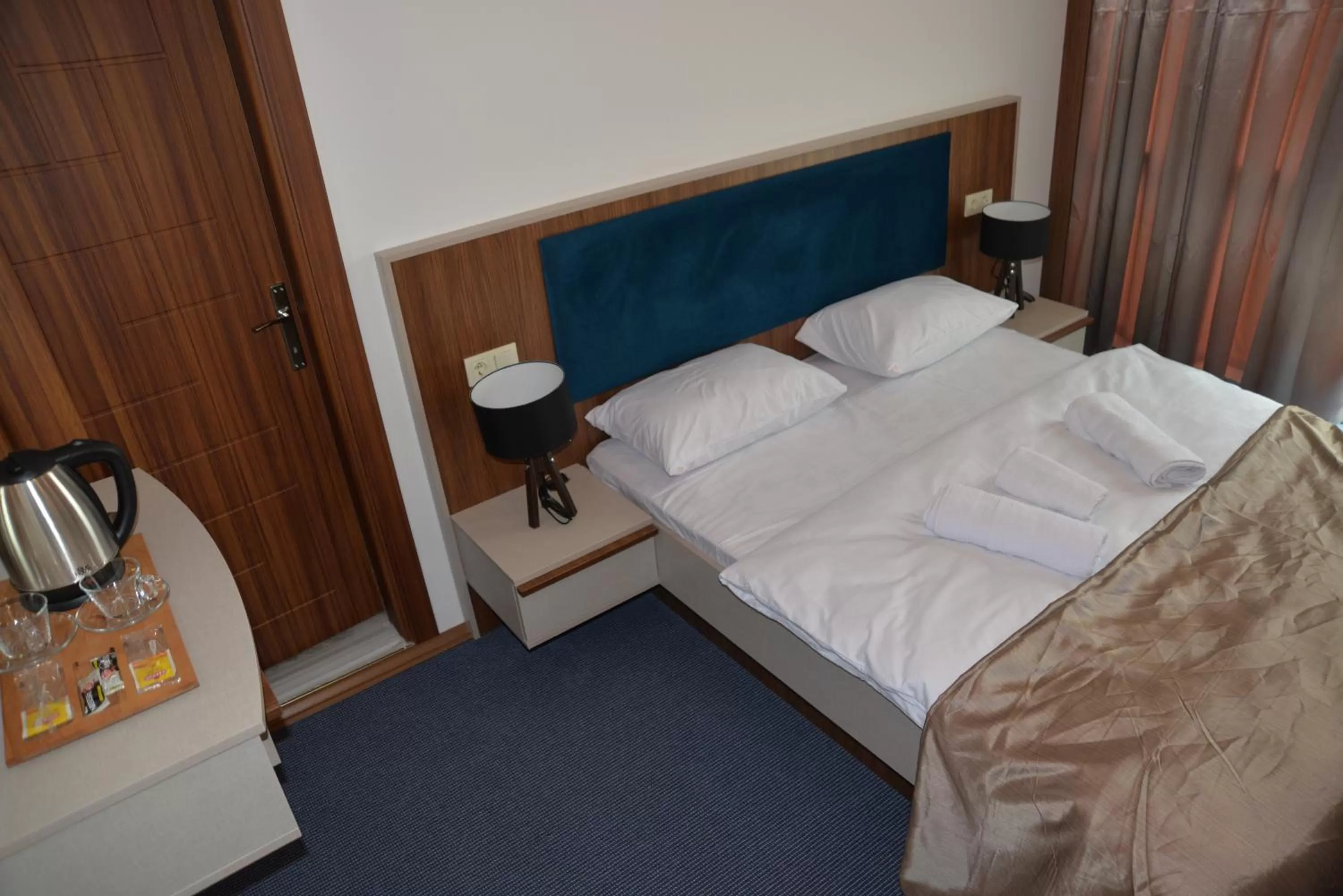 Bed in TEVETOGLU HOTEL