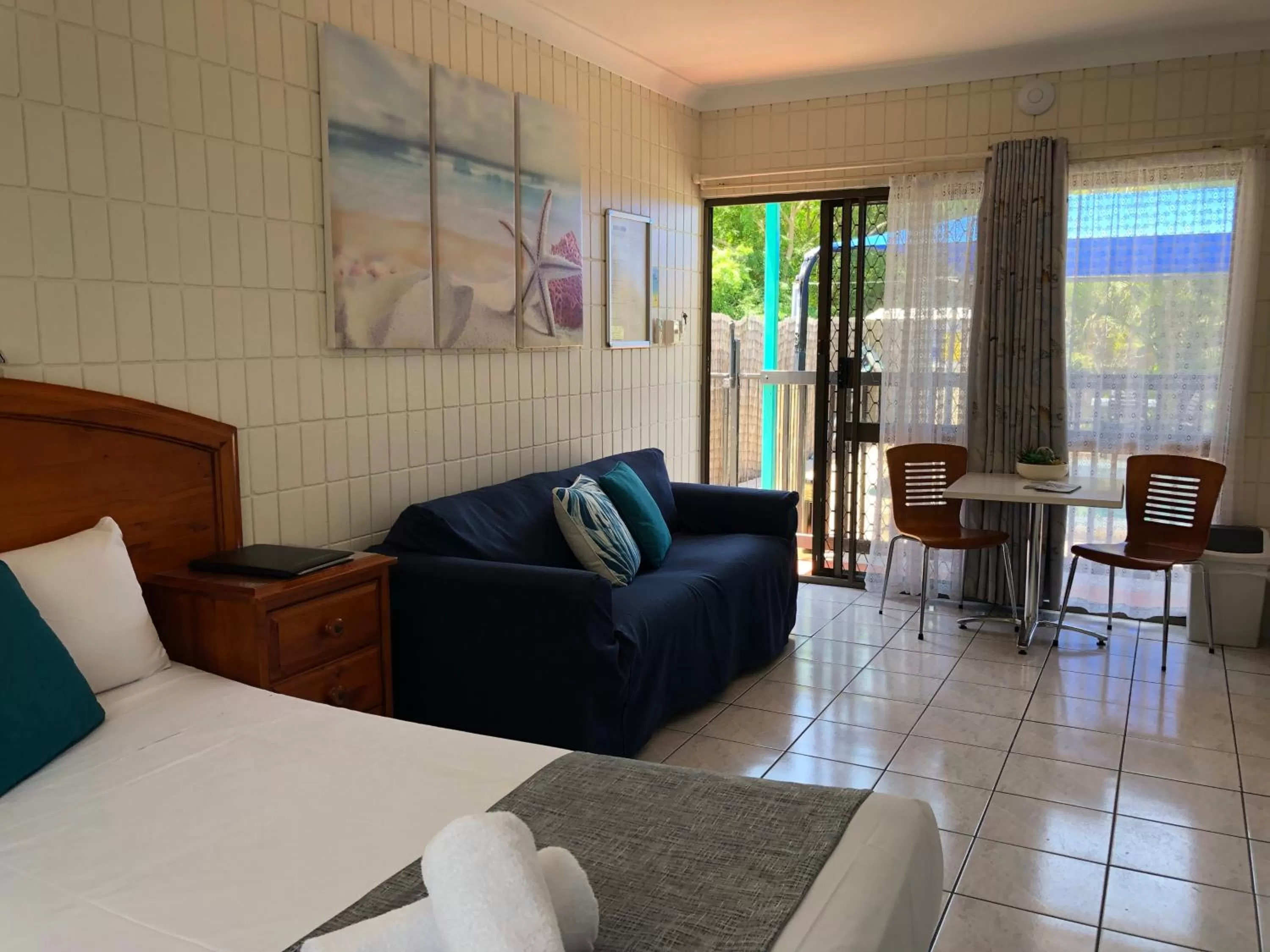 Bed in Tropical Palms Resort & 4WD Hire