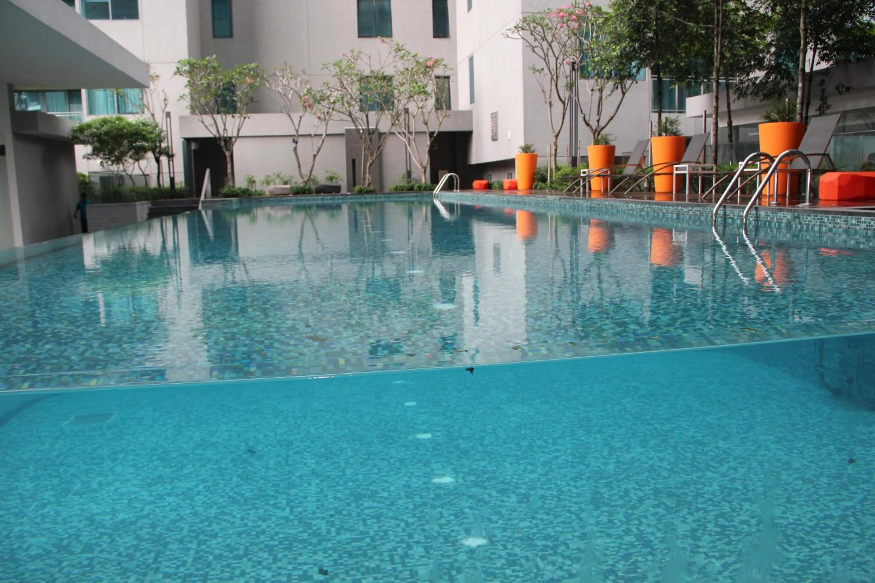 Swimming pool in Summer Suites Residences by Subhome