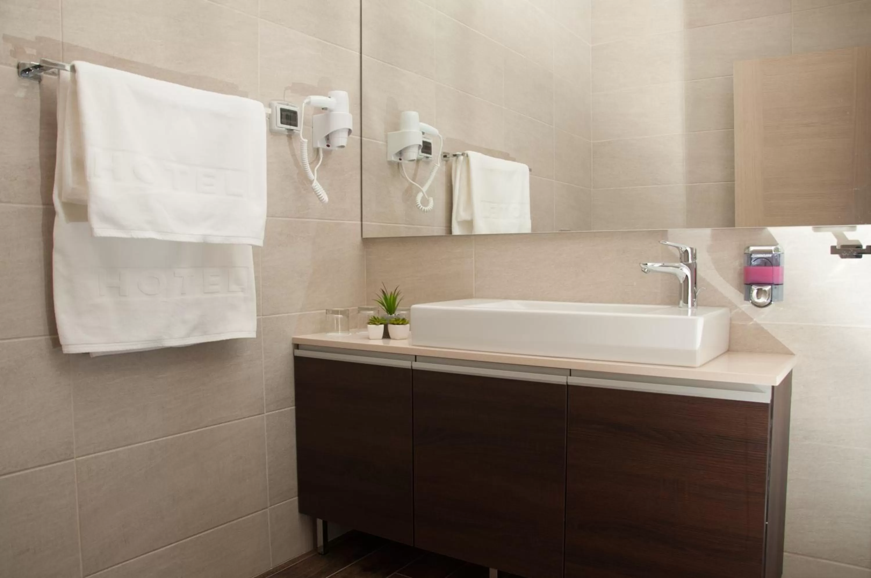 Bathroom in Garni Hotel Vigor - EV station