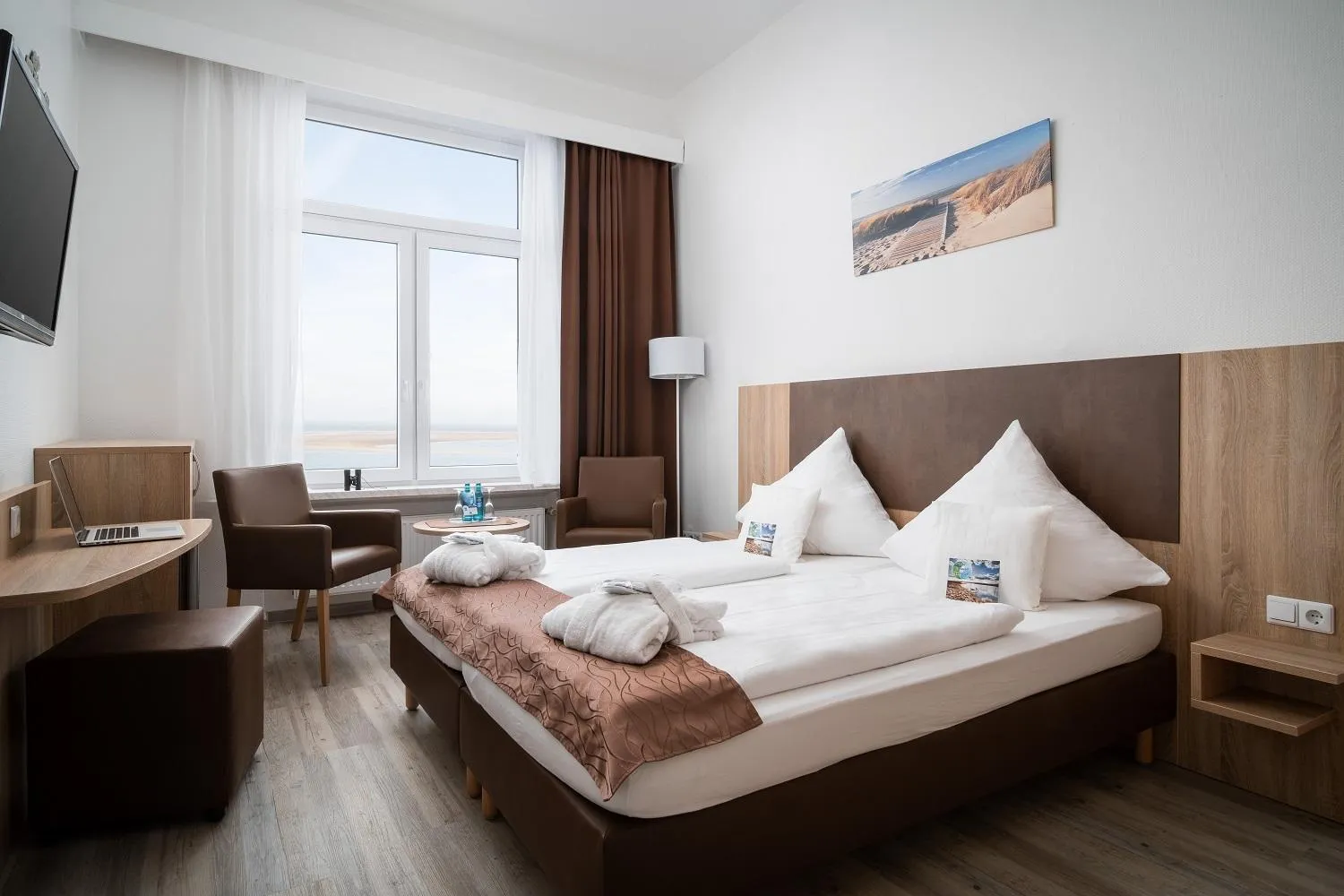 Photo of the whole room, Bed in Nordsee Hotel Borkum