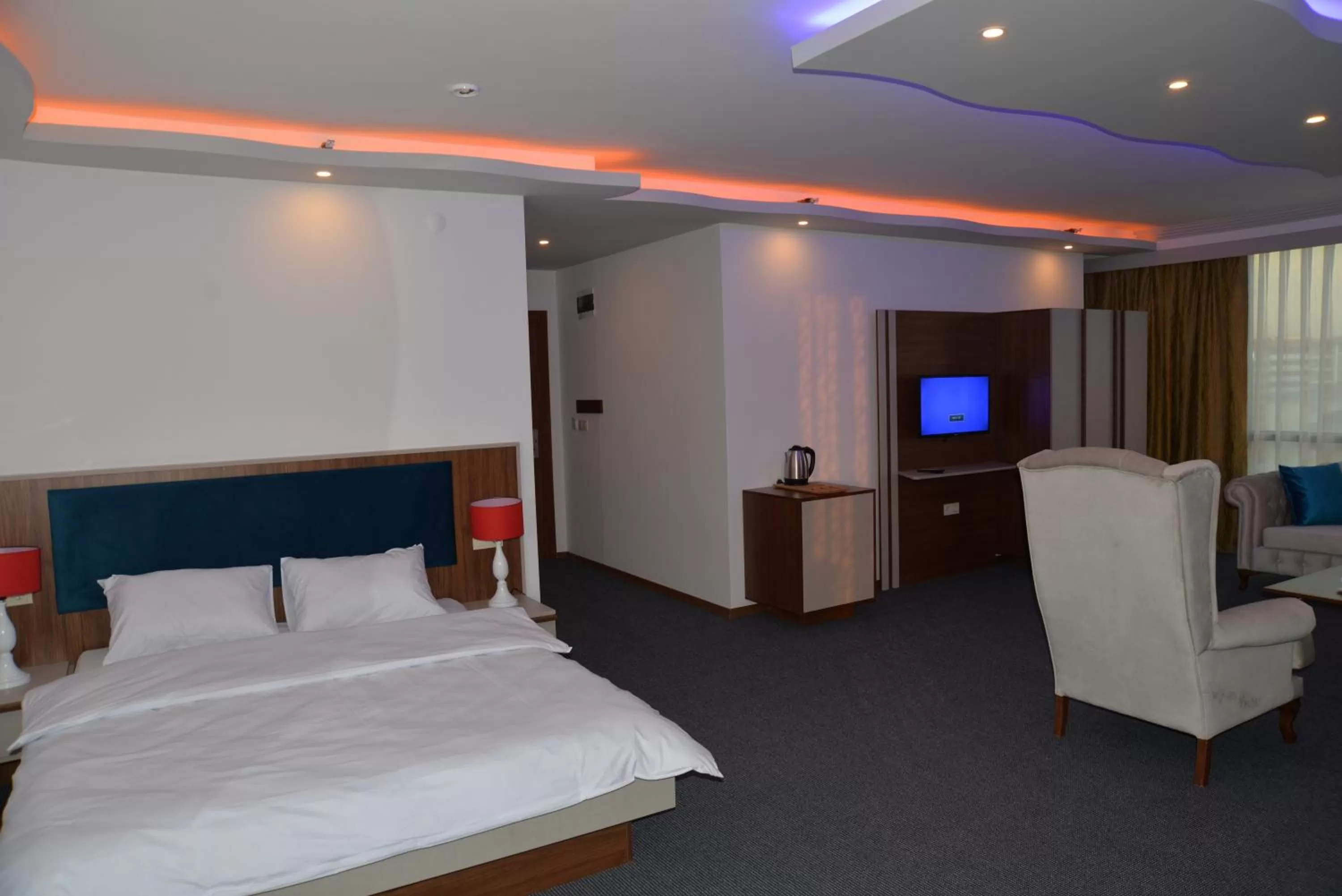 Bed in TEVETOGLU HOTEL