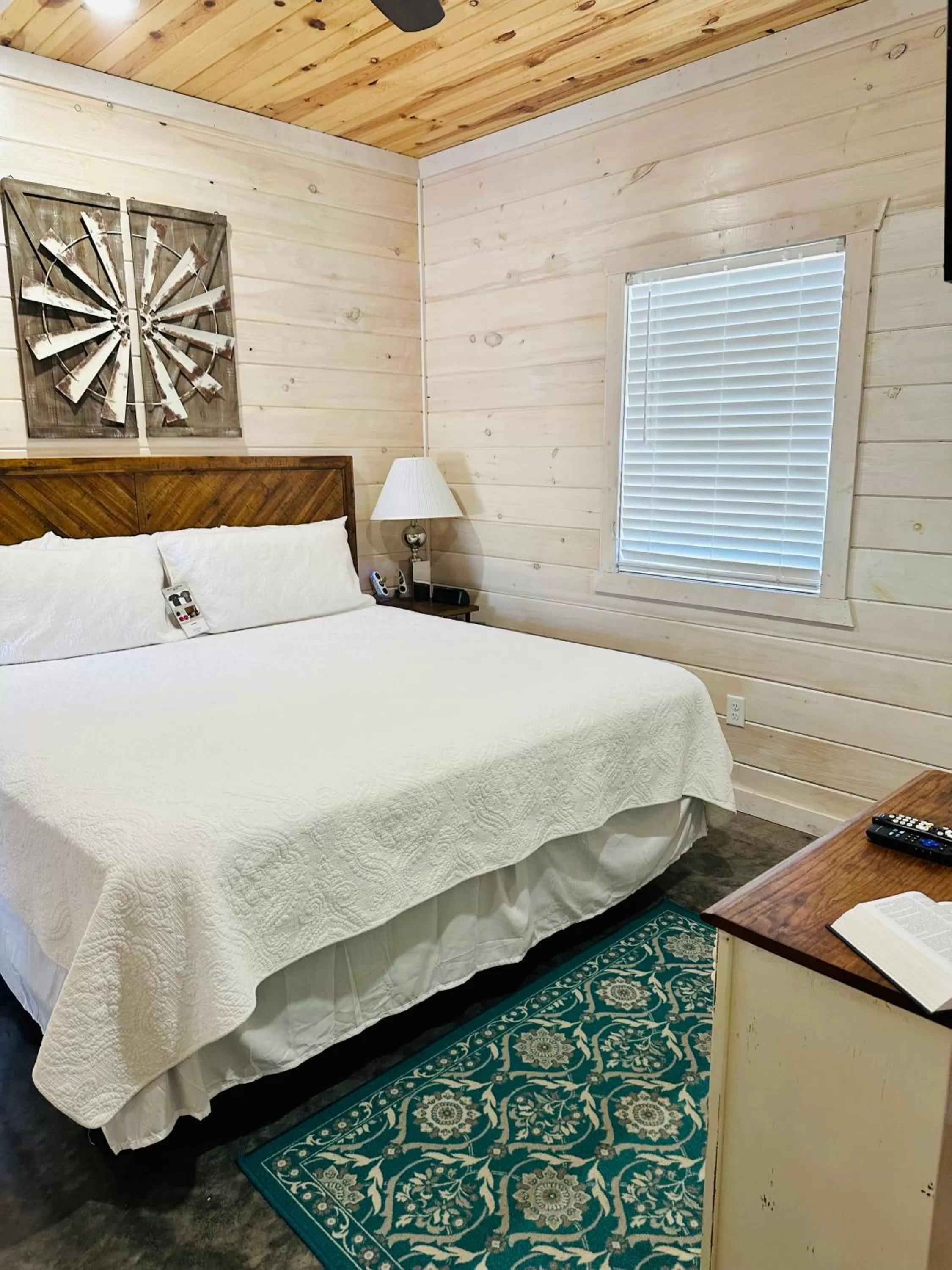 Bed in Knotty Squirrel Cabins