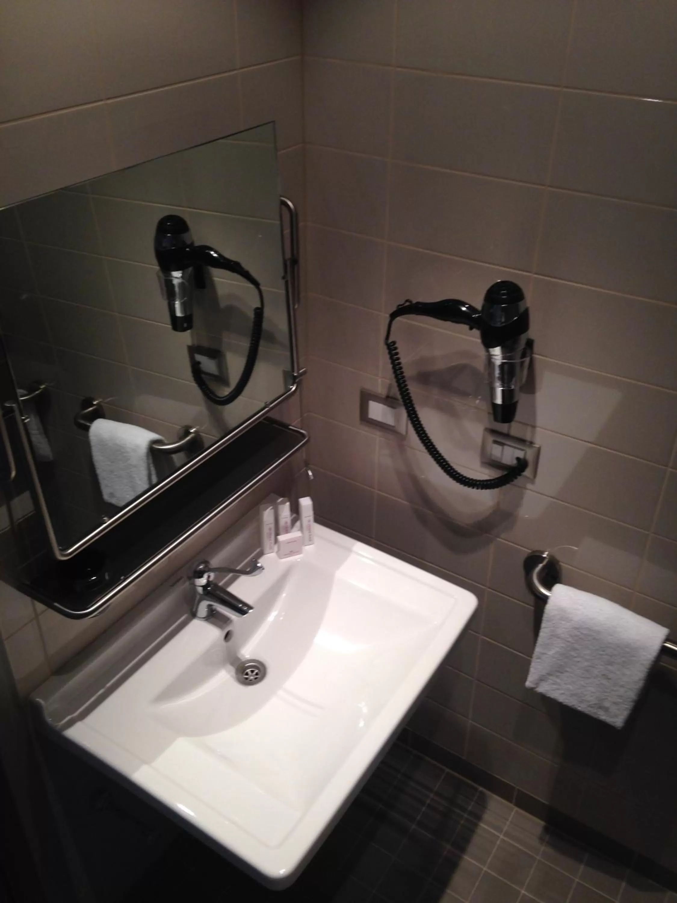 Bathroom in Crowne Plaza Verona Fiera by IHG