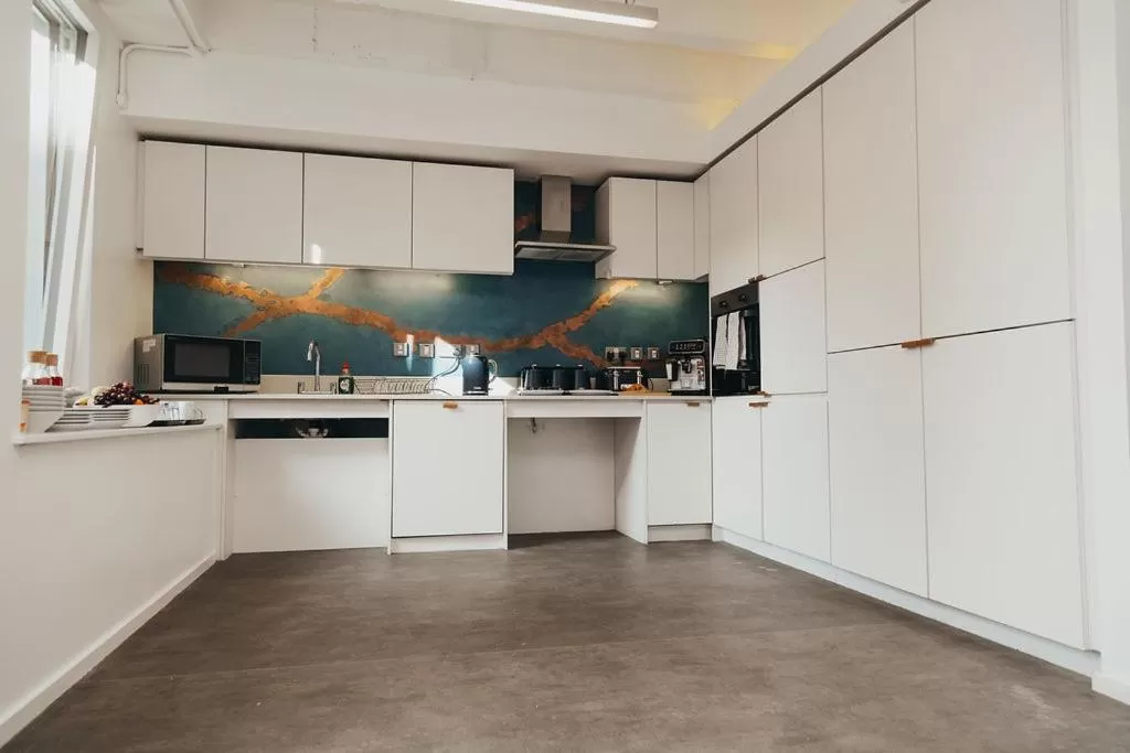 Communal kitchen in Quarter by the Warren Collection