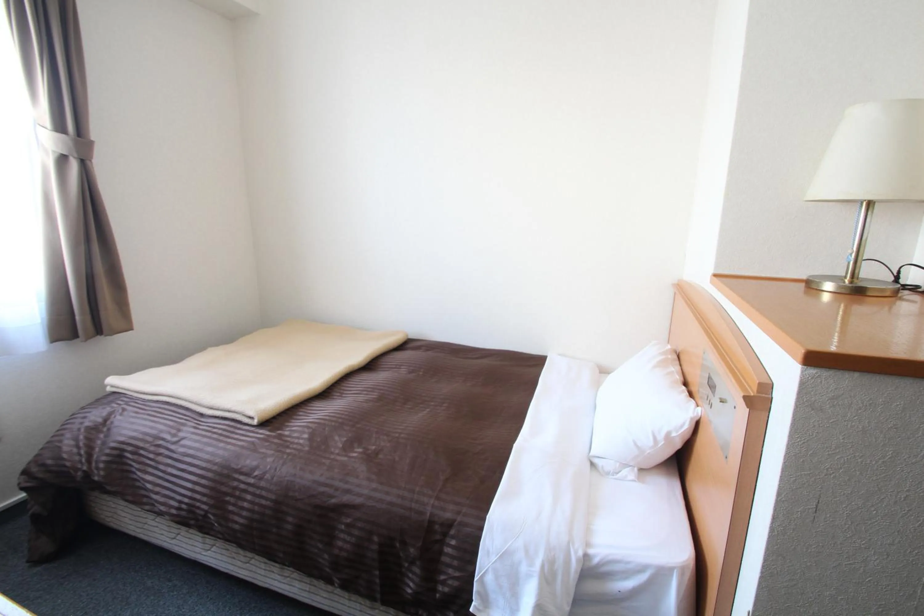 Bed in Sakura Hotel Hatagaya