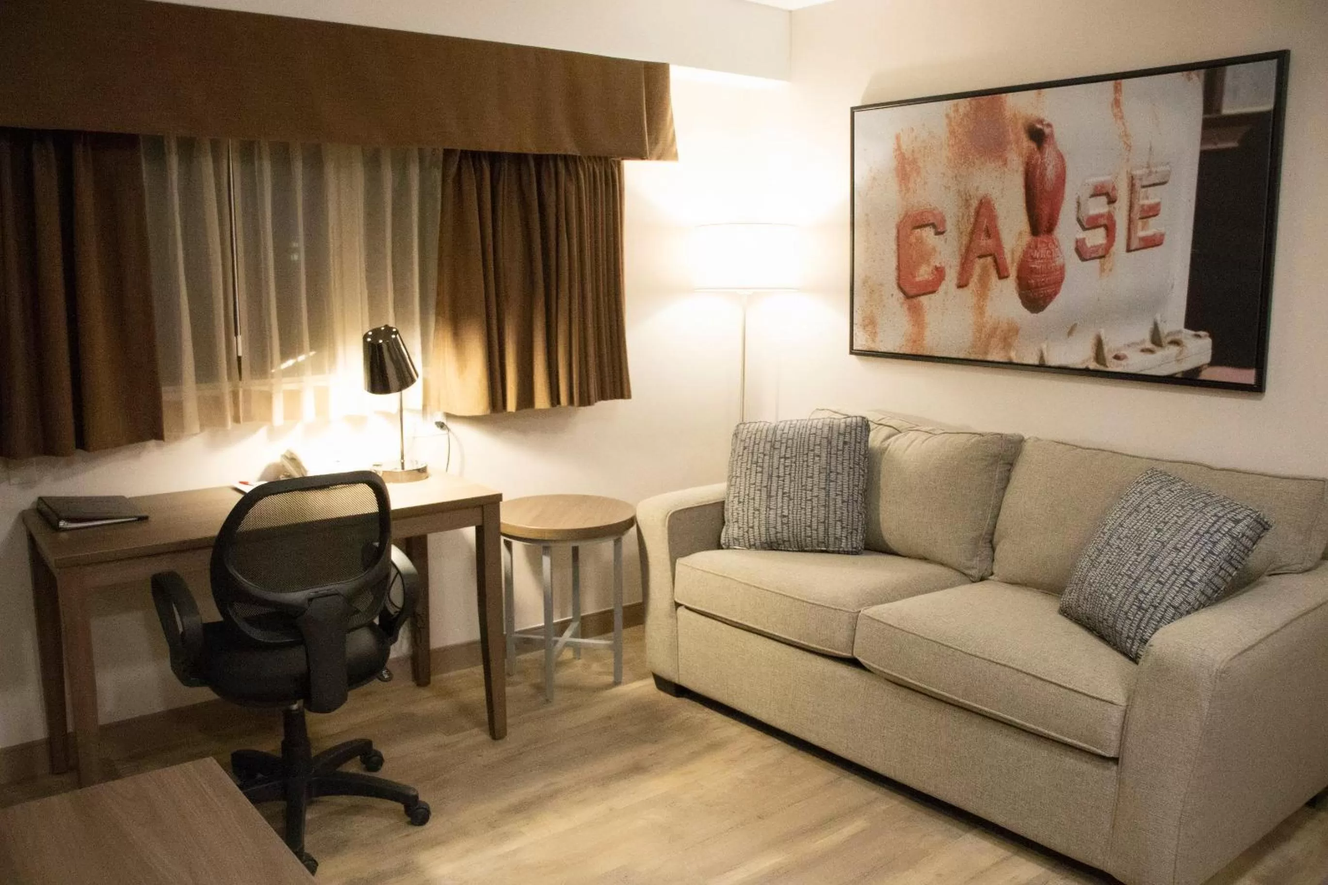 Seating area in Ramada by Wyndham Airdrie Hotel & Suites