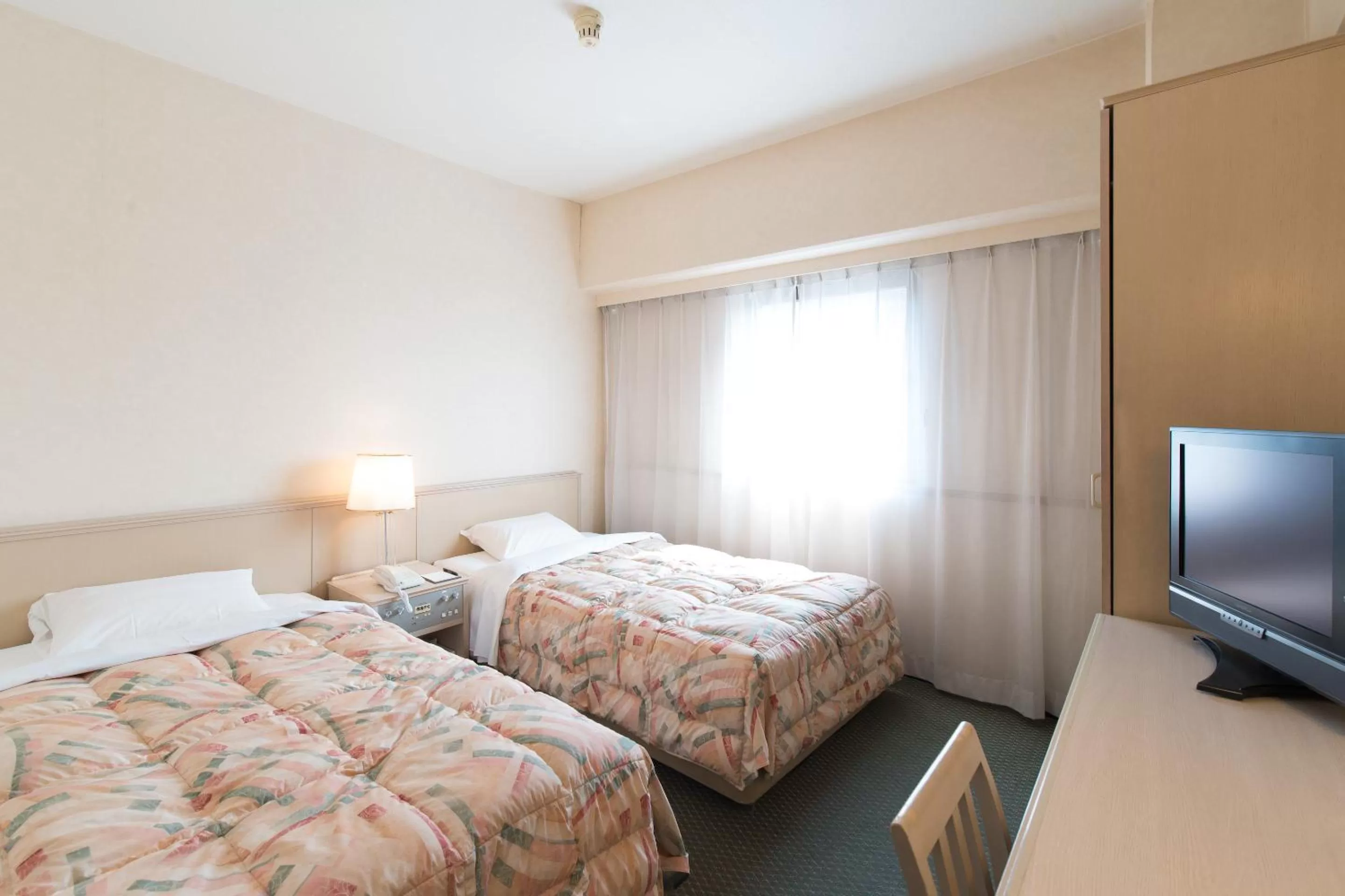 Photo of the whole room, Bed in Tabist Hotel Tetora Kitakyushu